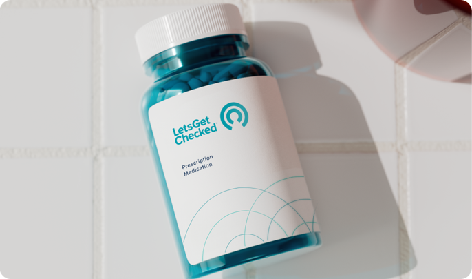 Display of LetsGetChecked affiliate pharmacy packaging, including a medication bottle, branded envelope, and delivery pouch, representing home-delivered services.