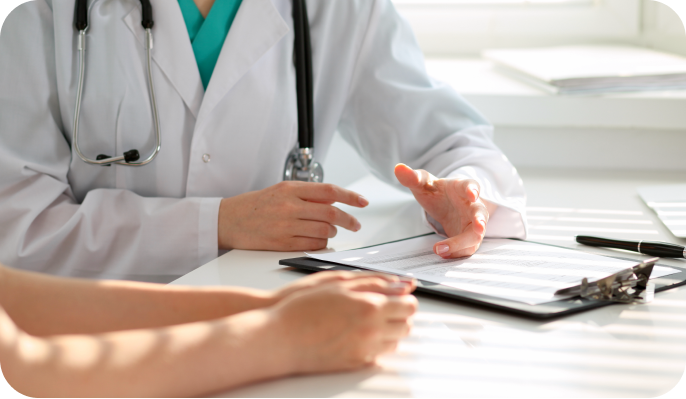 Close-up of a healthcare professional in a lab coat explaining results on their clipboard to a patient. Close-up of a healthcare professional in a lab coat explaining results on their clipboard to a patient.