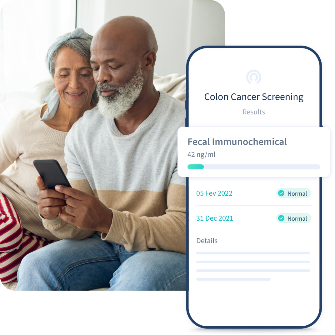 Older man and woman looking at colon cancer screening results on phone