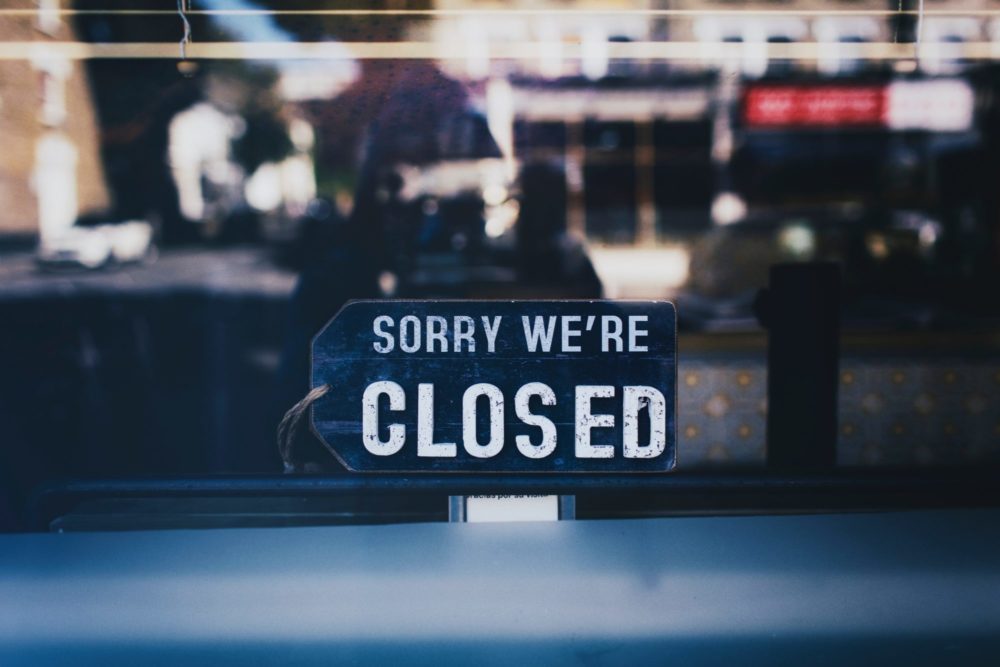 a blue sign with white text