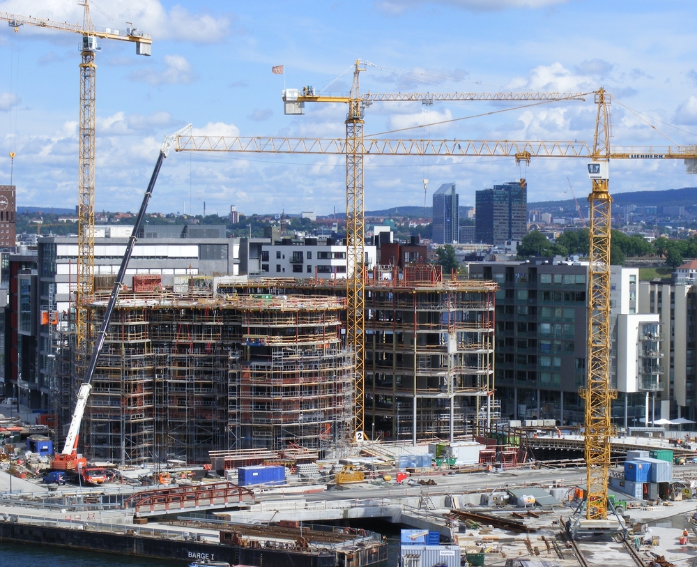 a construction site with cranes