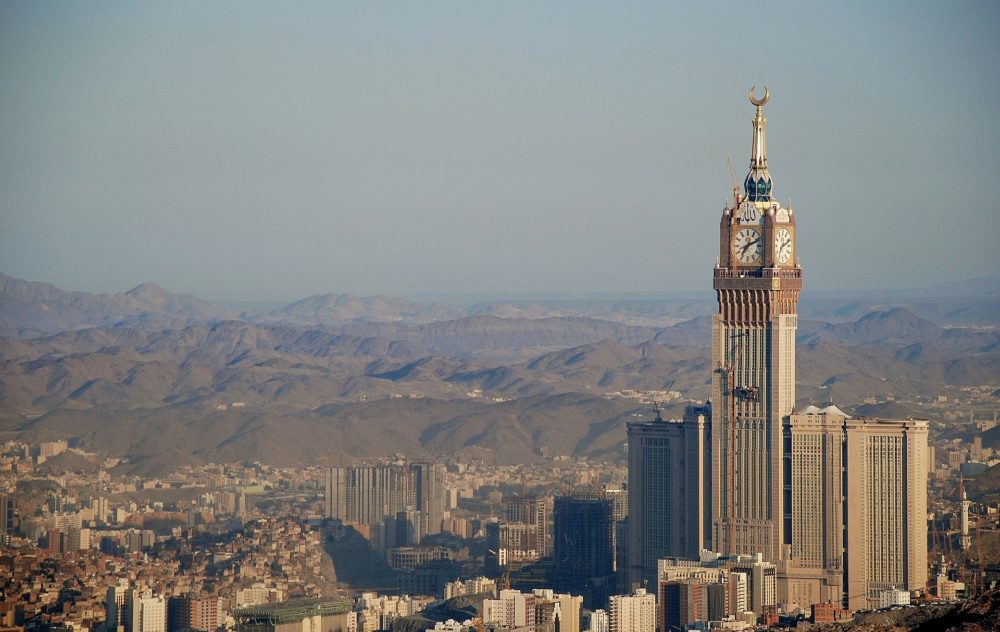 a city with a tall building and a clock tower