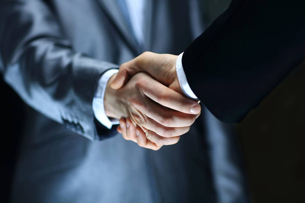 close-up of a man shaking hands