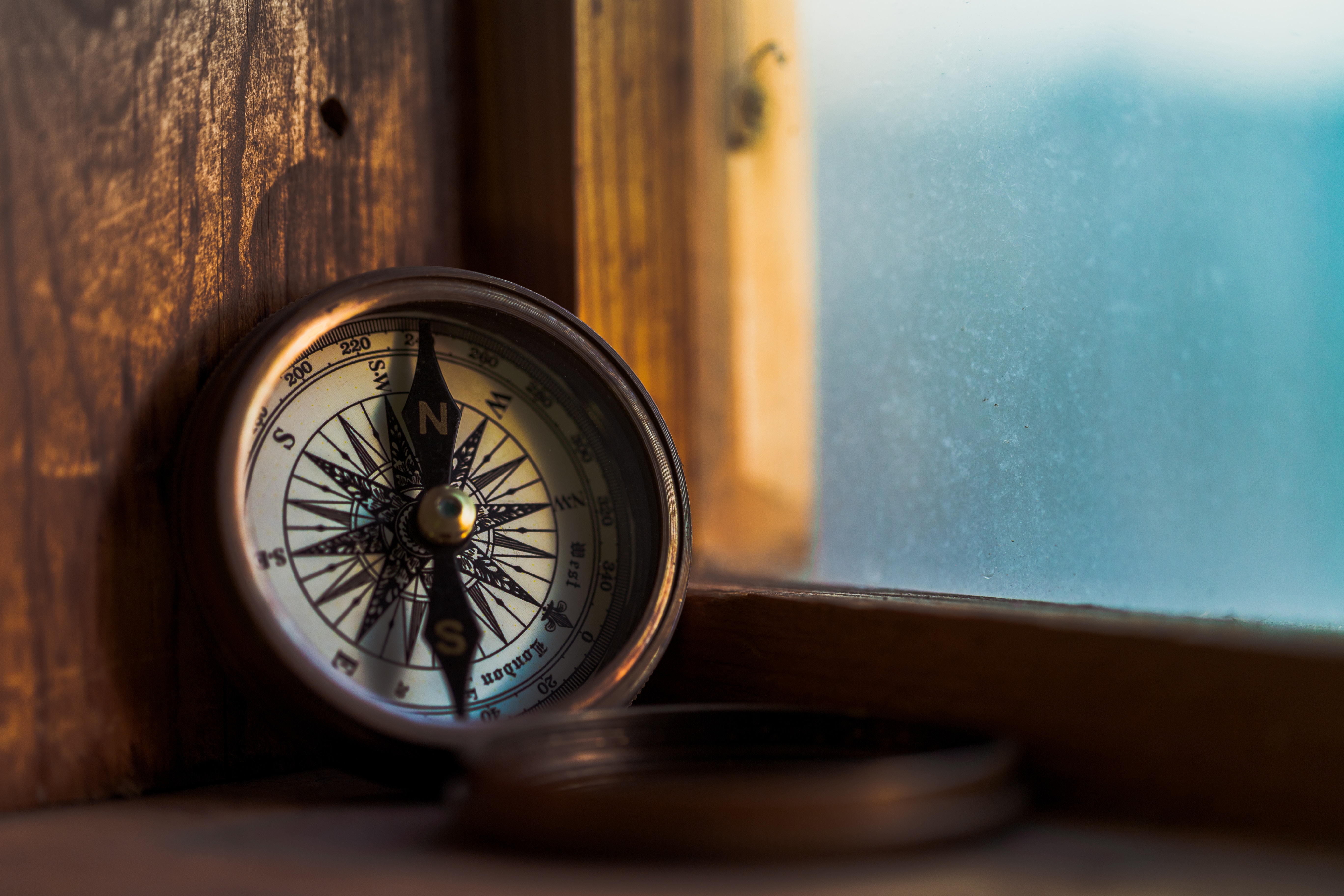 a compass on a book