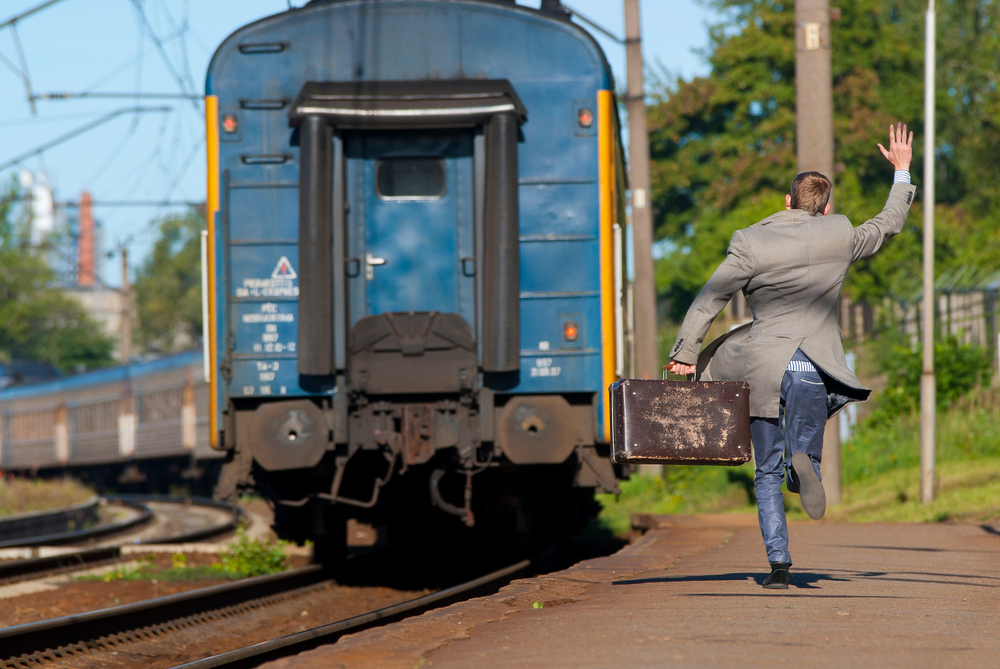 a man jumping off of a train