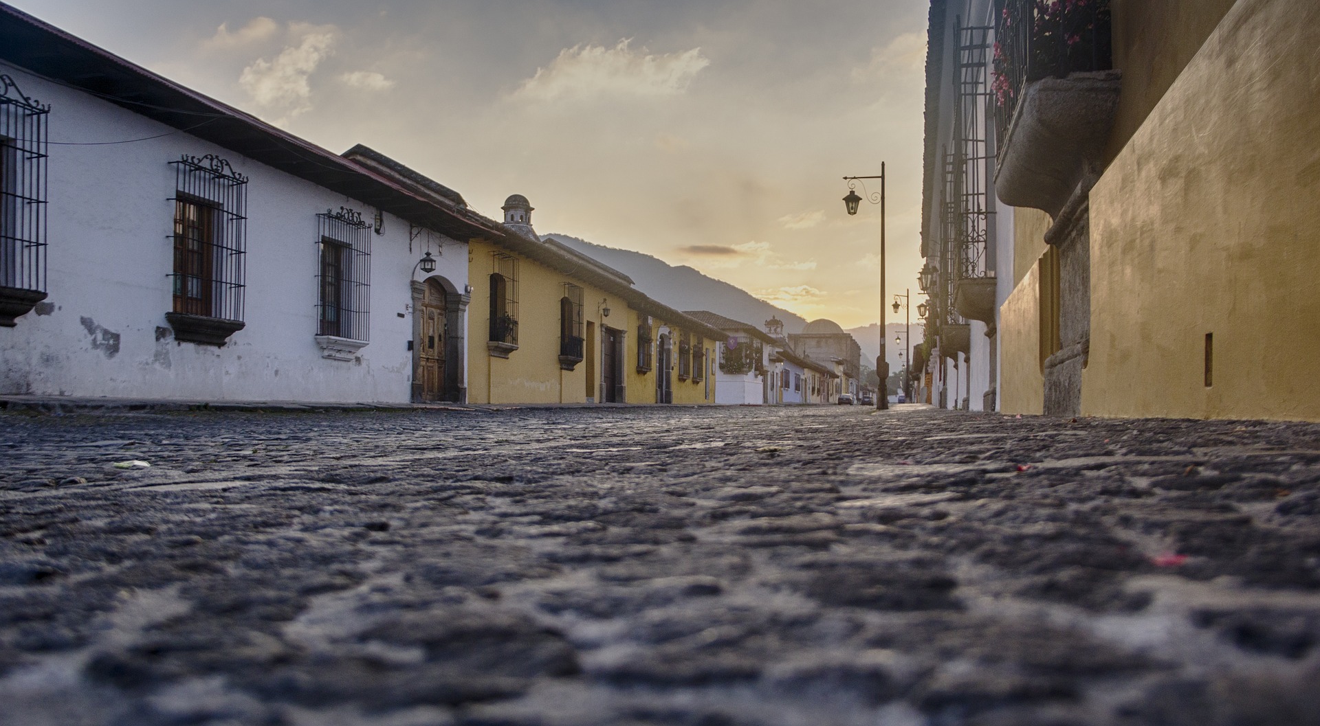 a snowy street with buildings