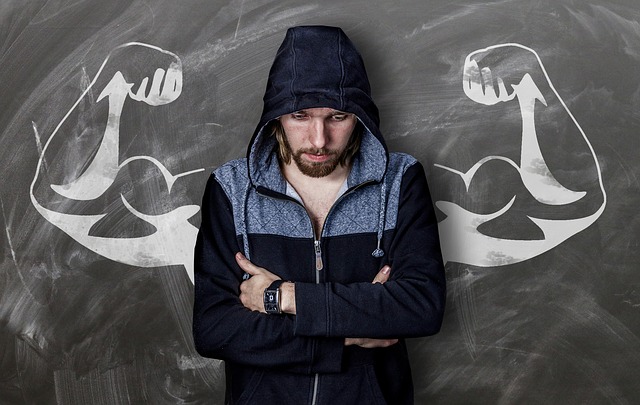 a man standing in front of a chalkboard