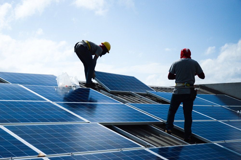 men working on solar panels