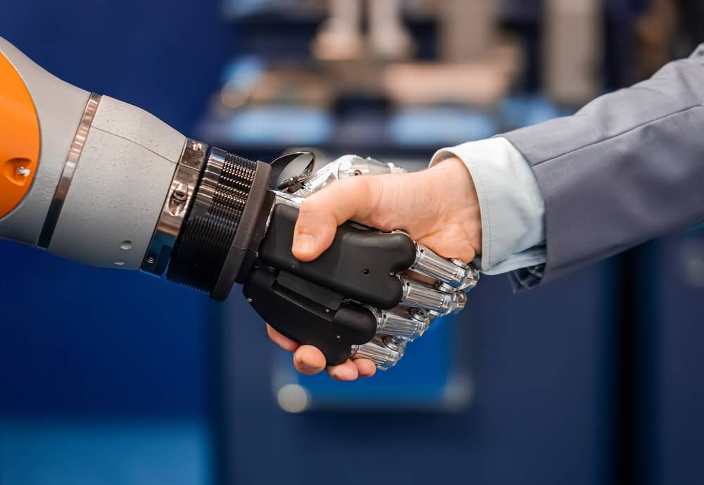AI robot handshake with businessman