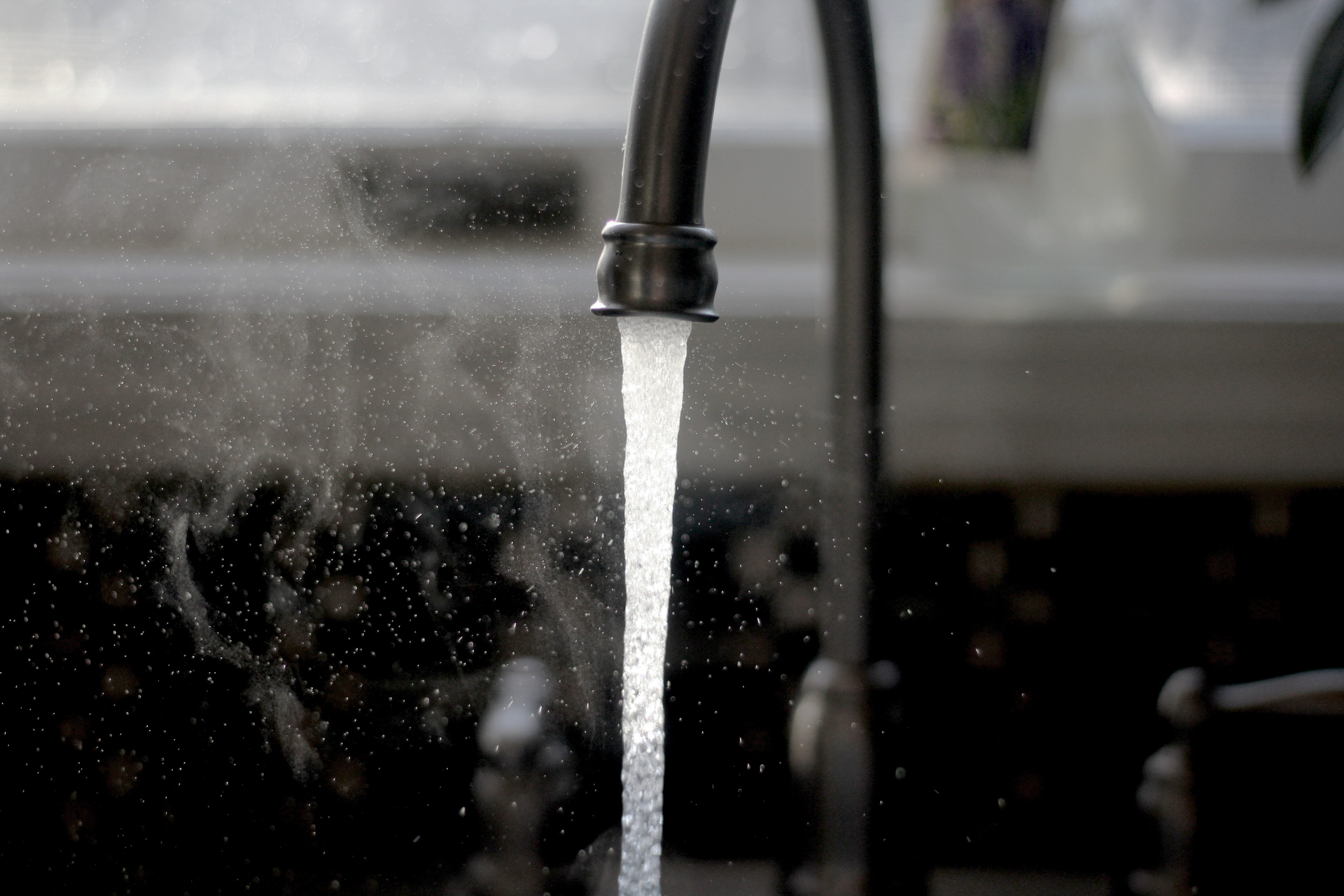 a water spouting out of a window