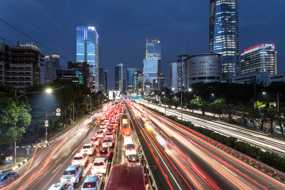 a city street with cars and buildings