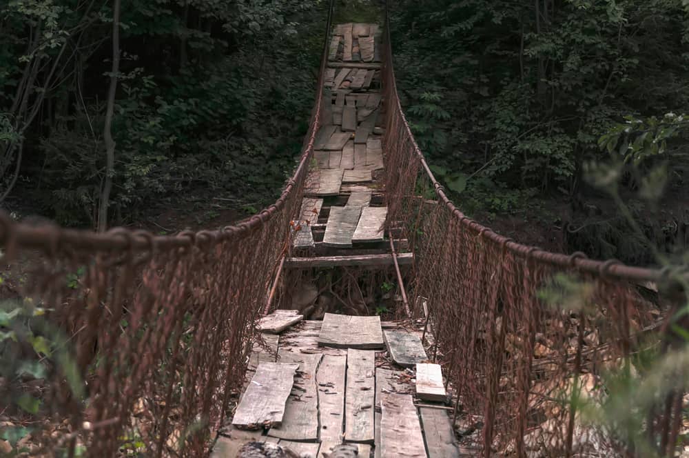 a wooden bridge over a river