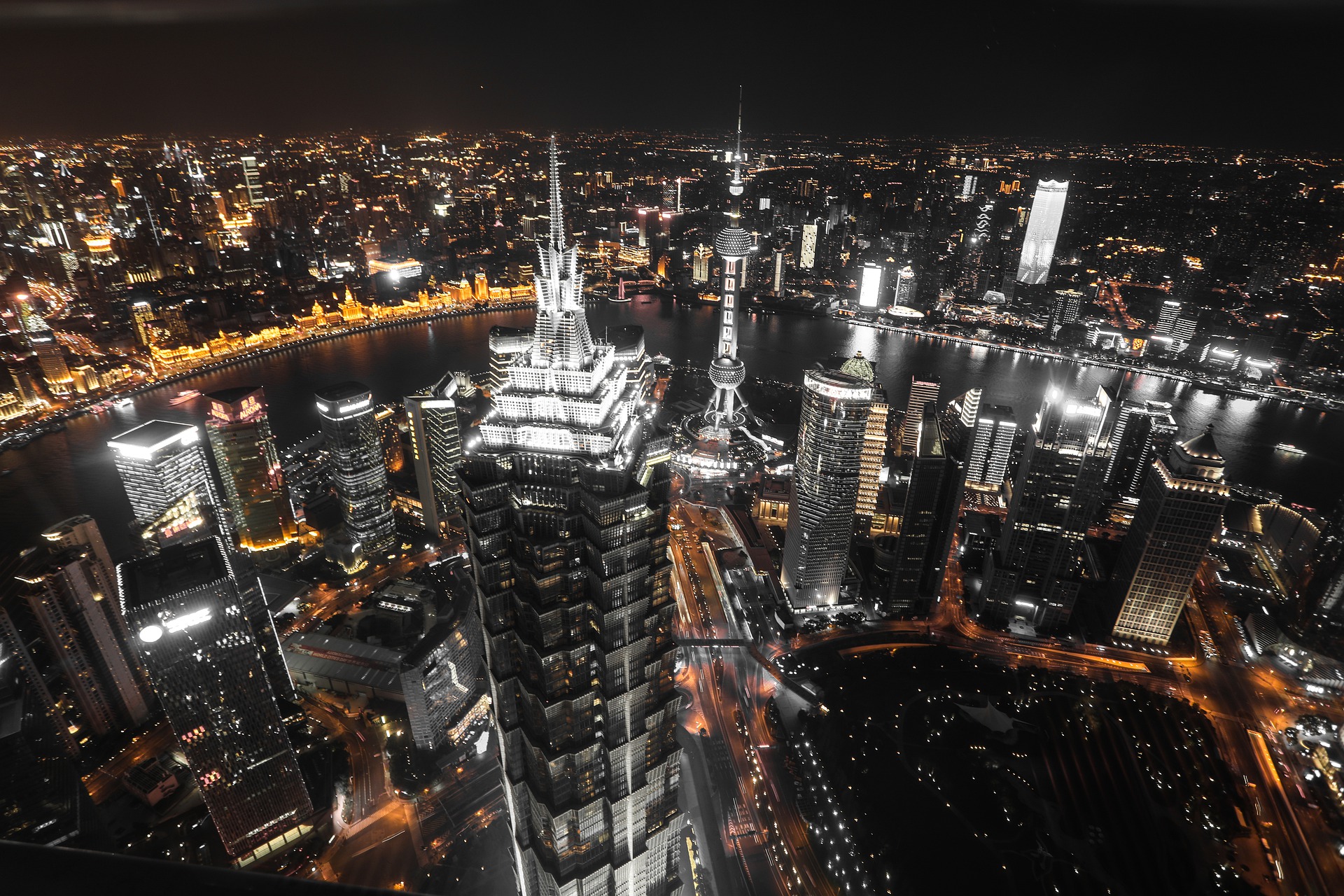 a large city with a tall building at night