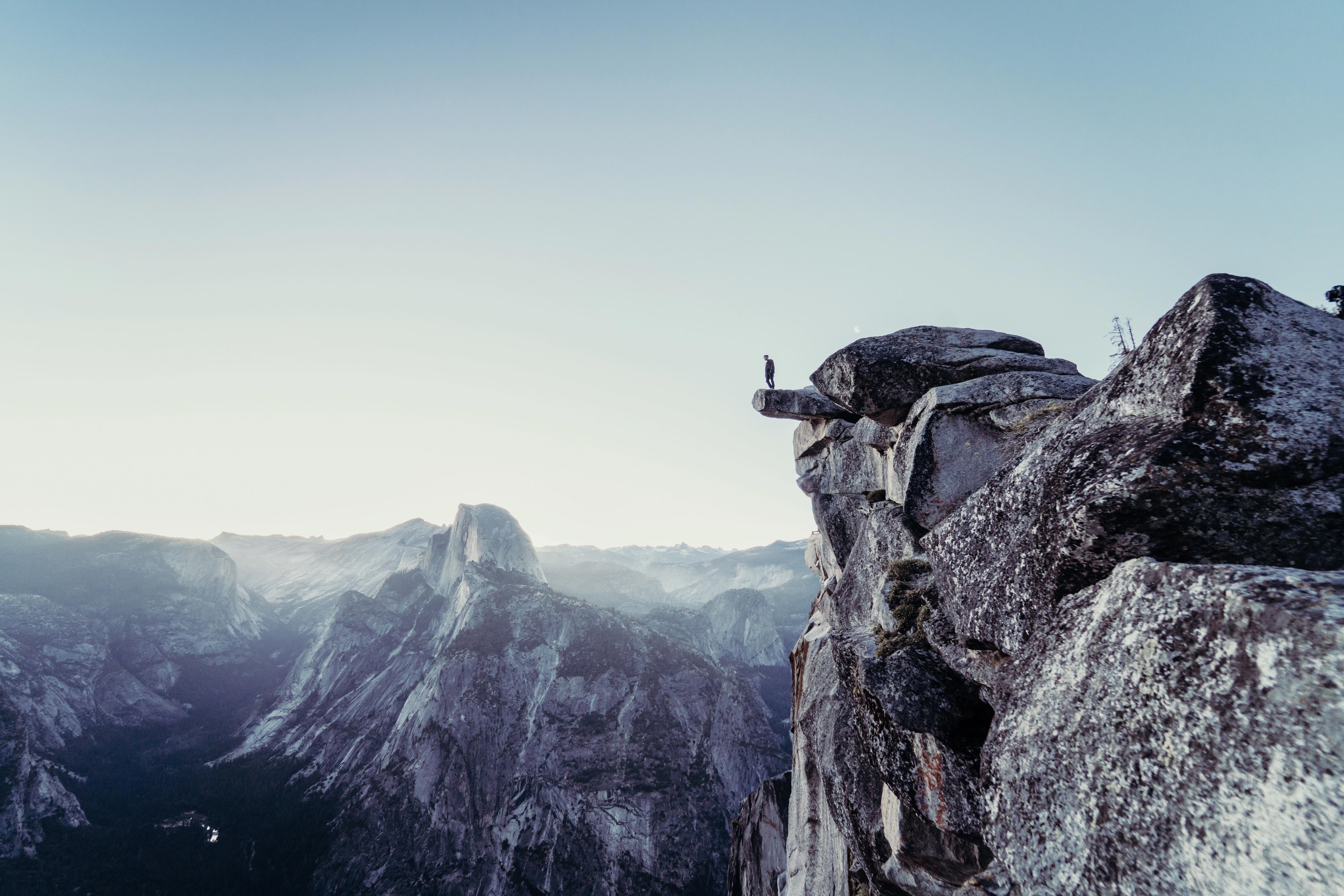 a person standing on a rock