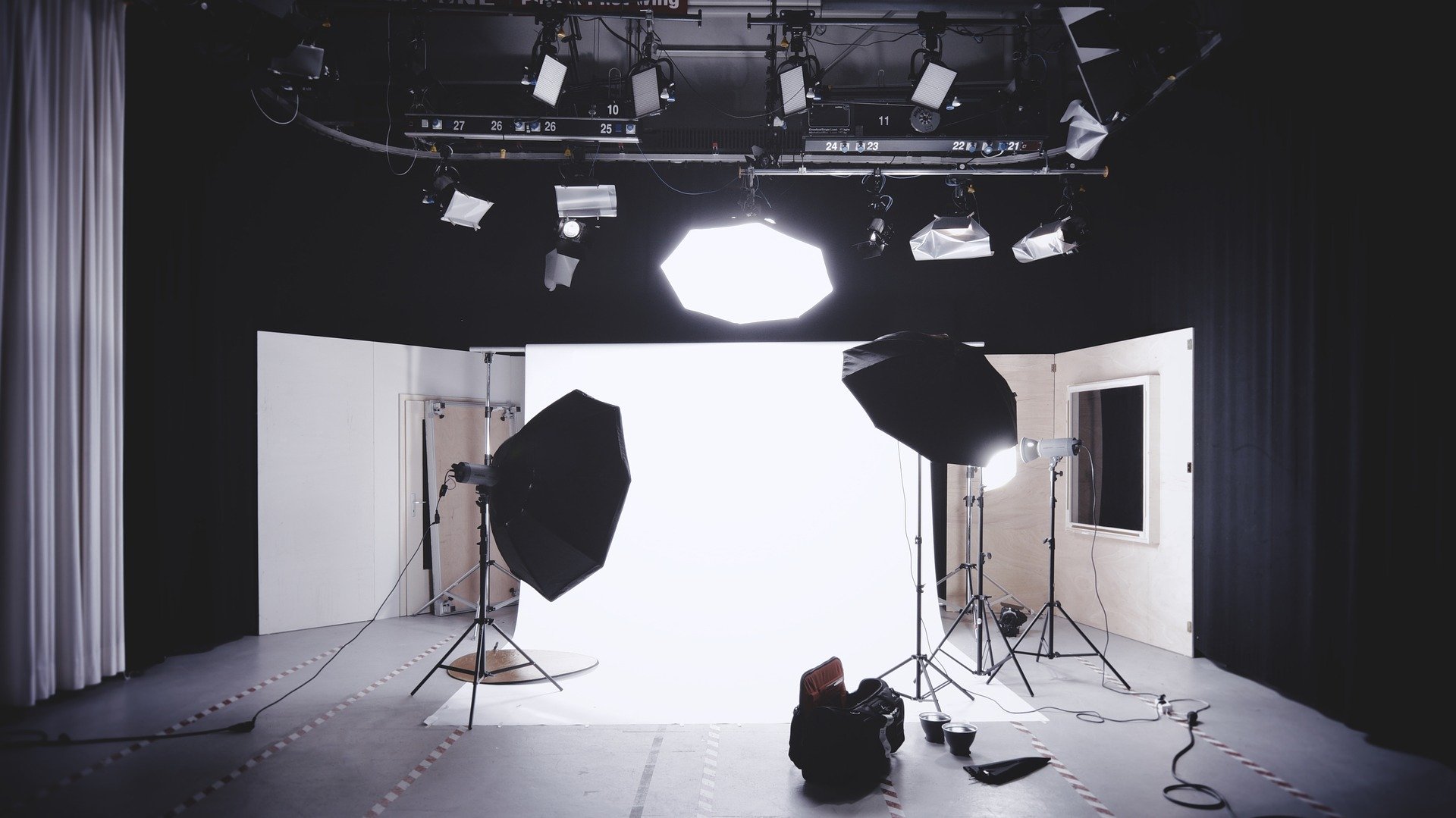 a studio with a camera and a tripod