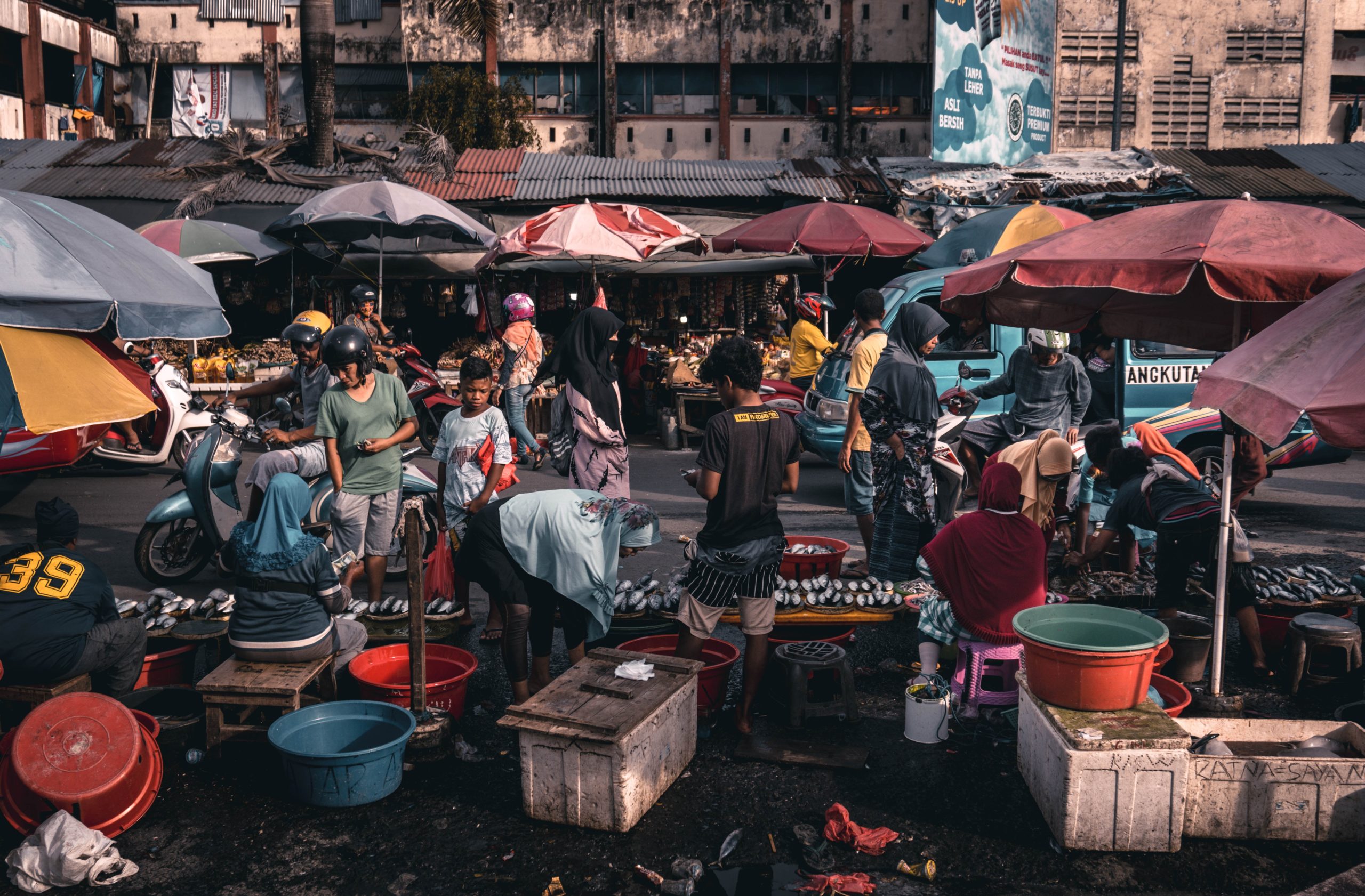 a group of people stand in a market