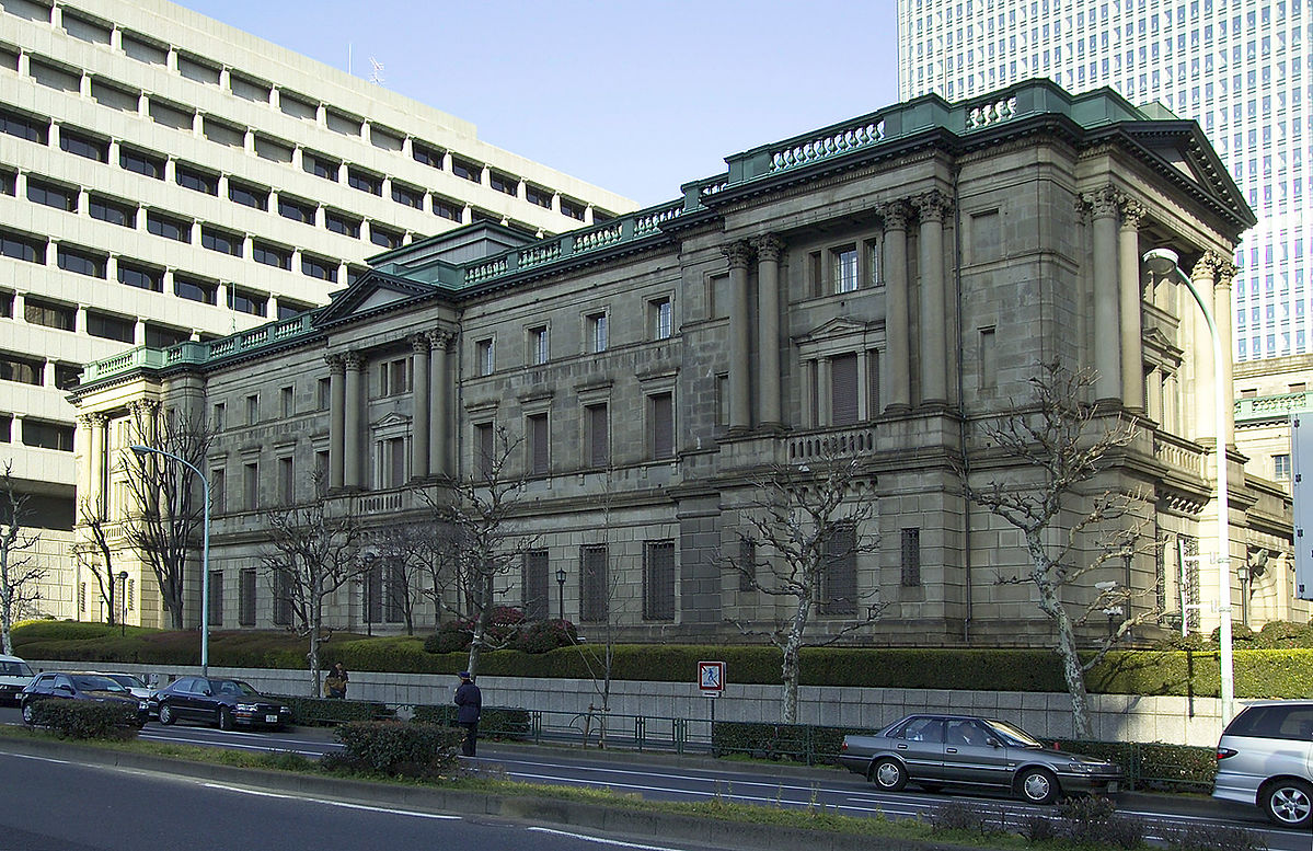 a building with cars parked in front