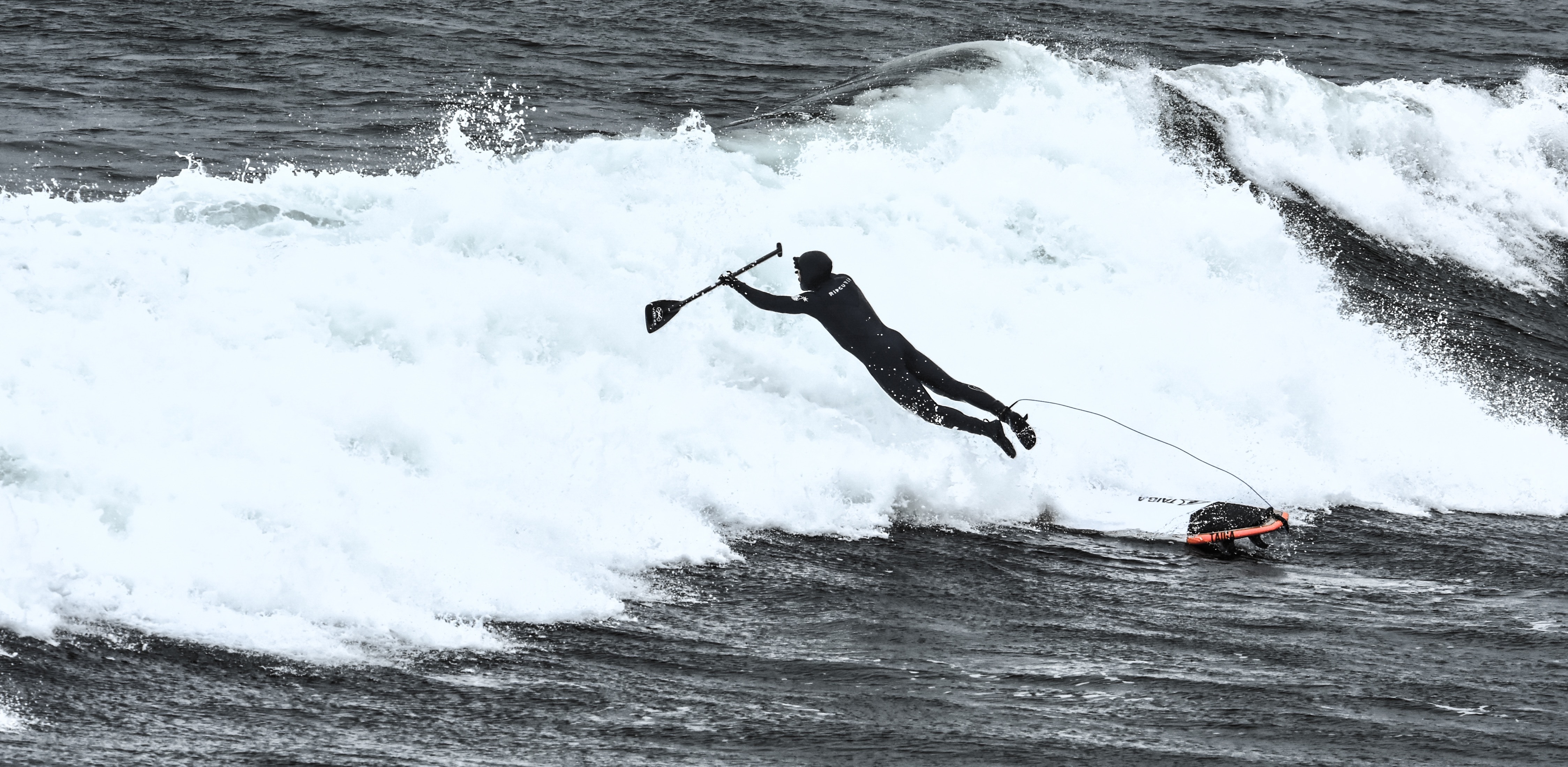 a person surfing on the waves