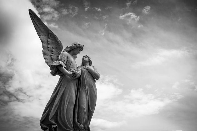 a statue of a man holding a bird