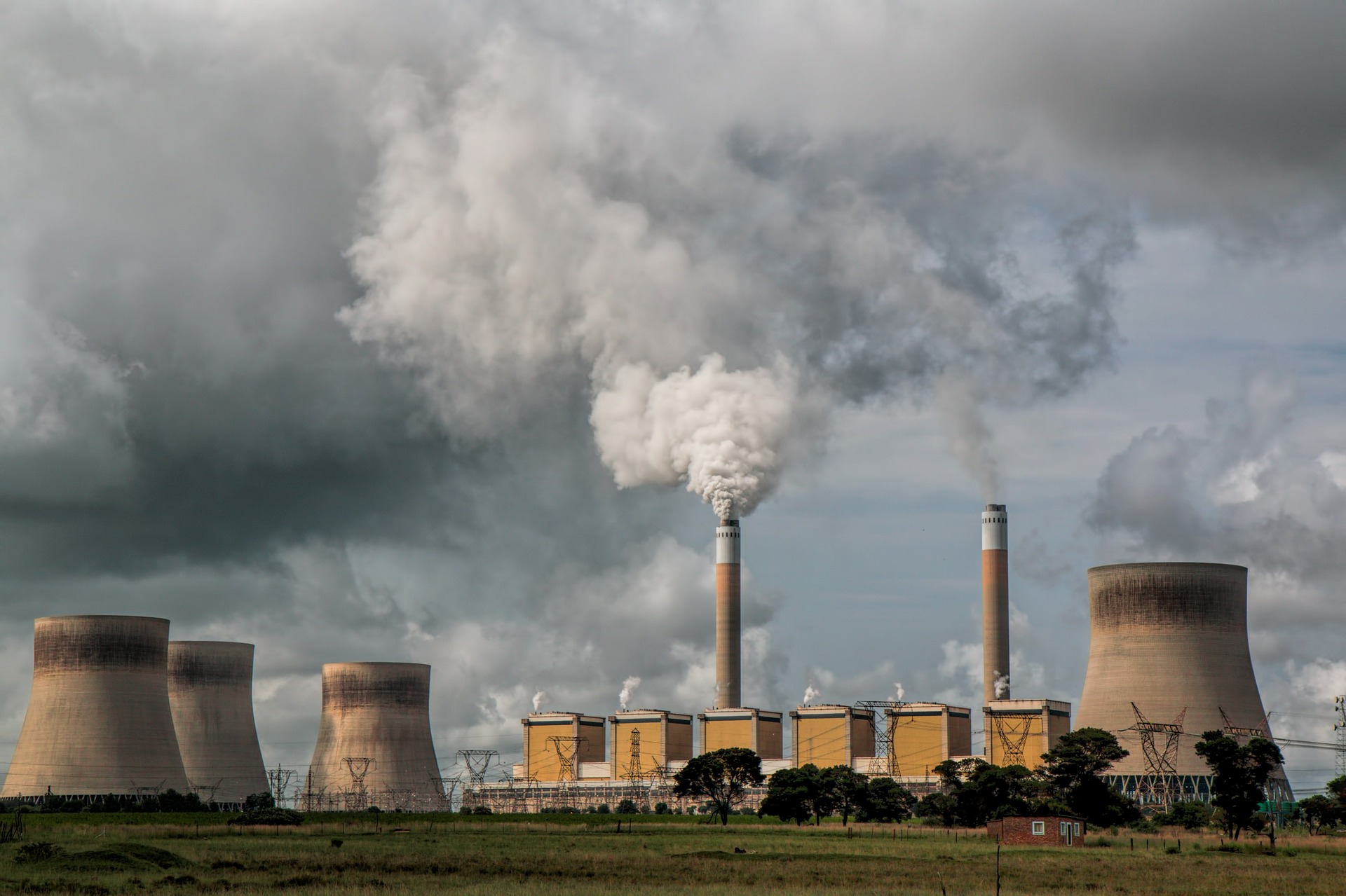 a factory with smoke coming out of the top