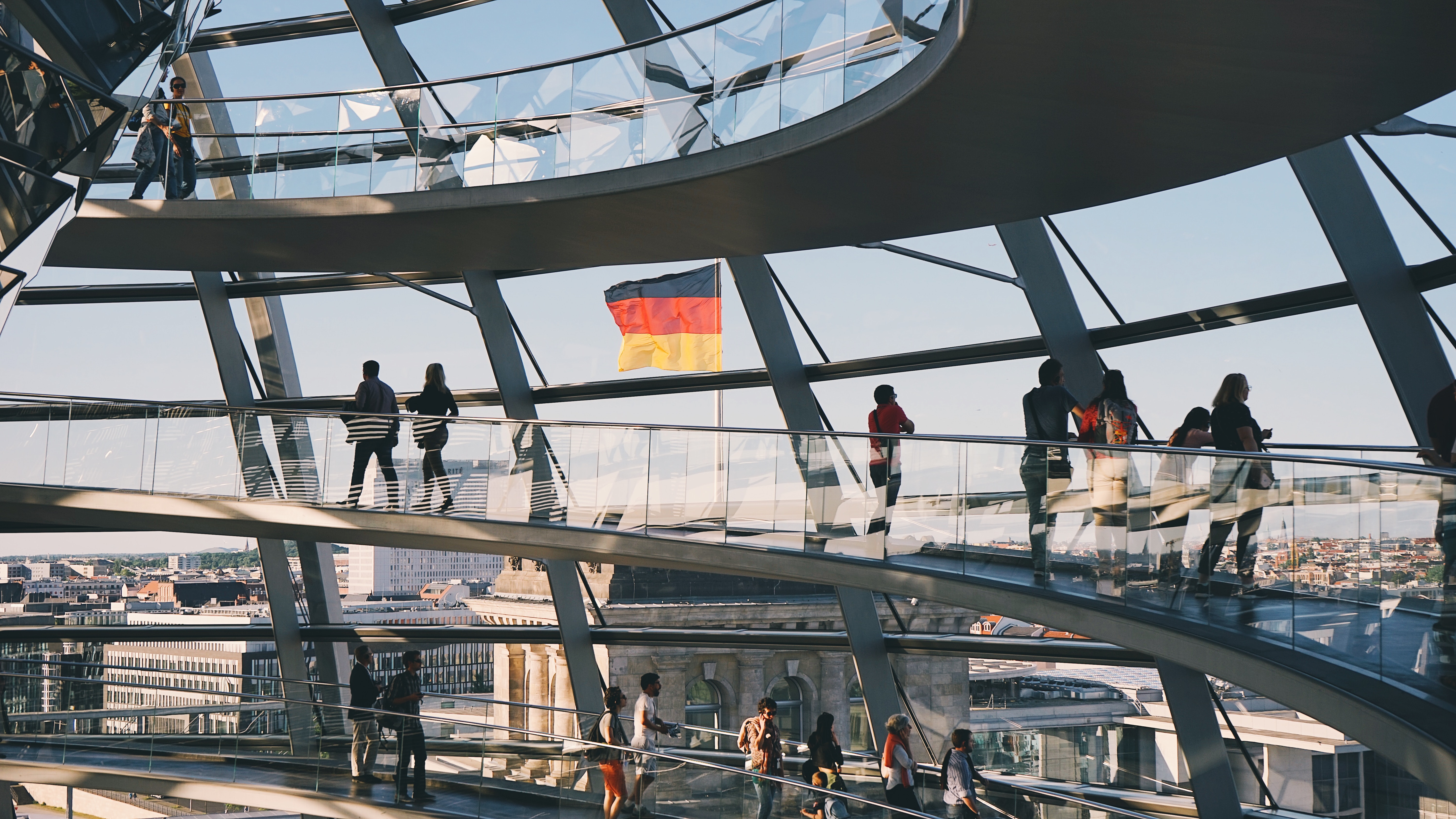 a group of people walking on a bridge