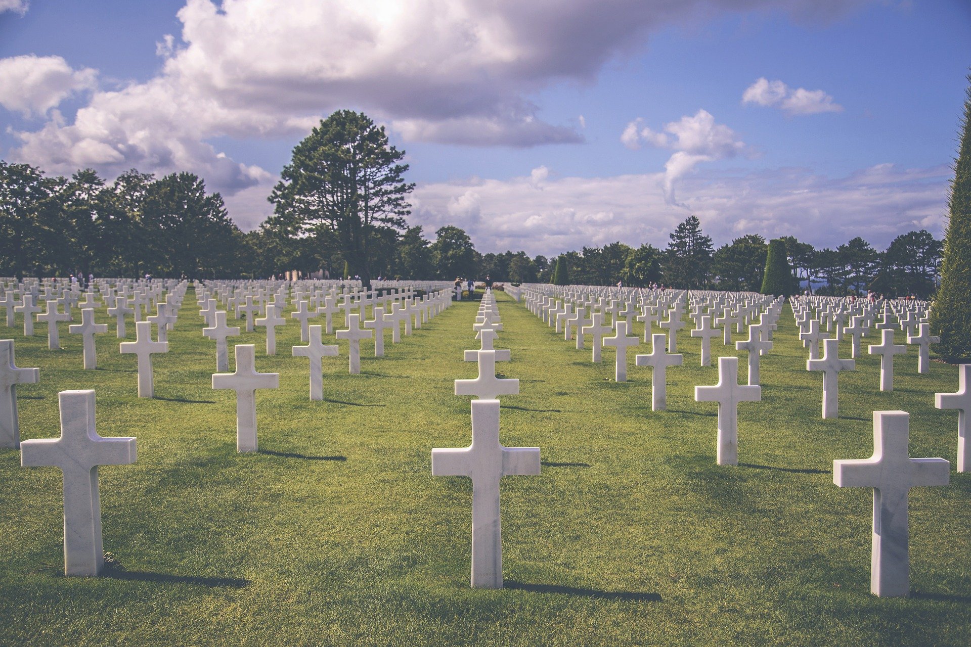 a cemetery with white crosses