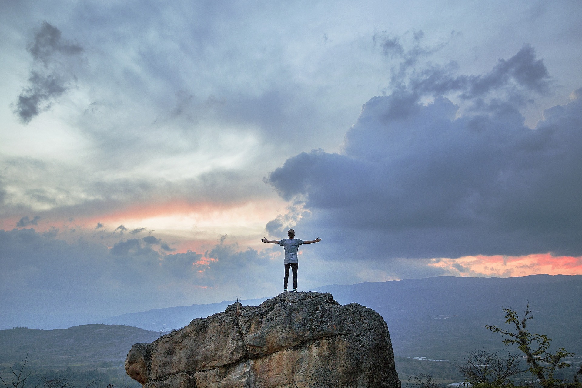 a person standing on a rock