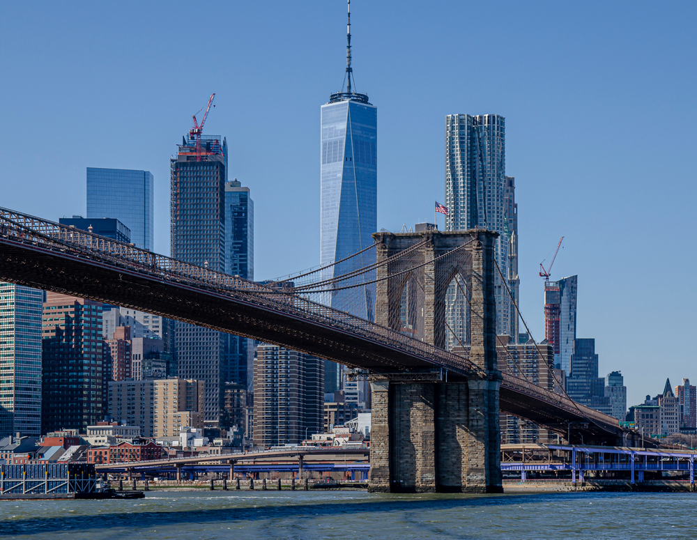 a bridge with a city in the background