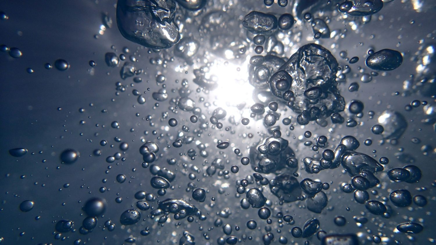 water droplets on a blue surface
