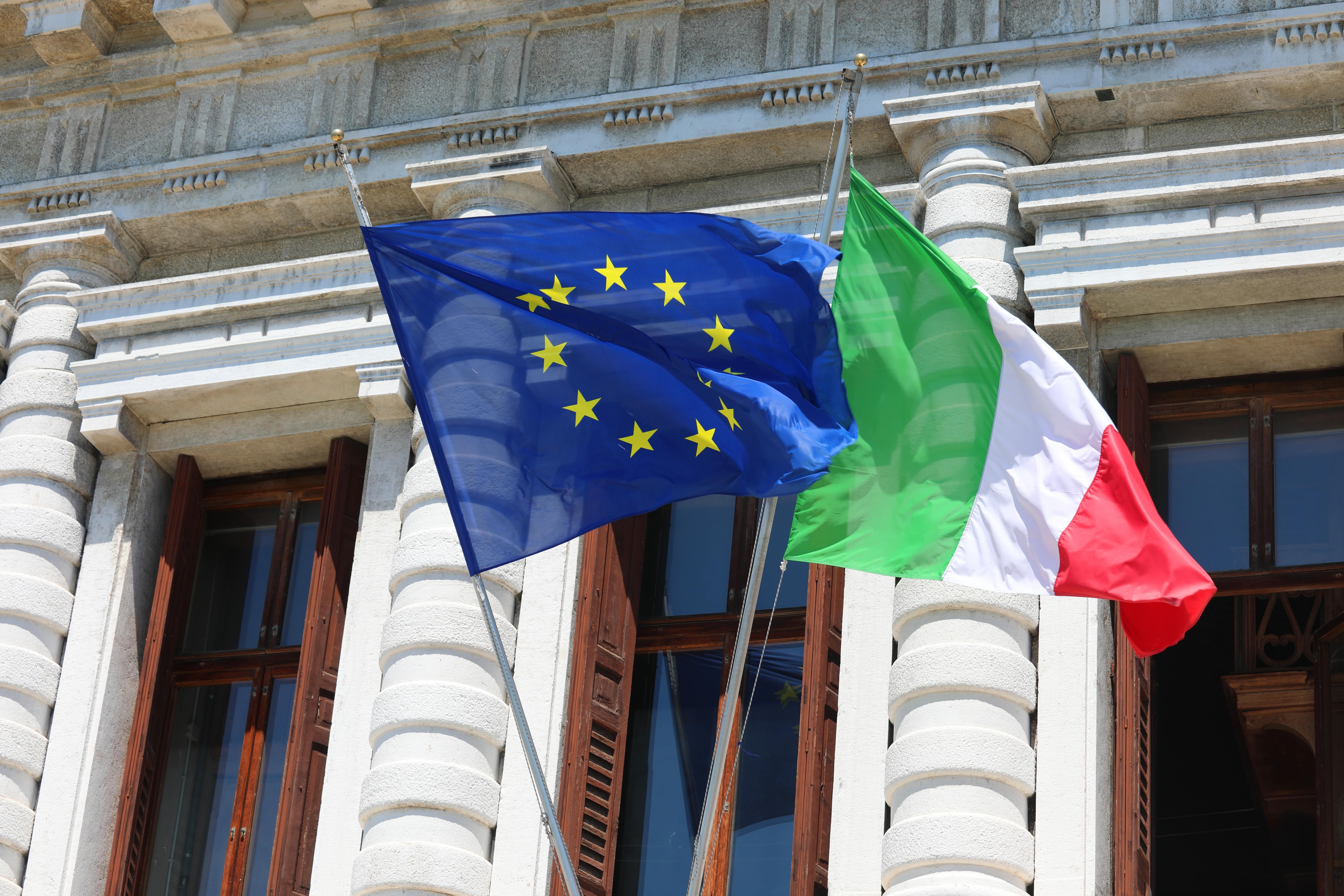 a few flags from a building