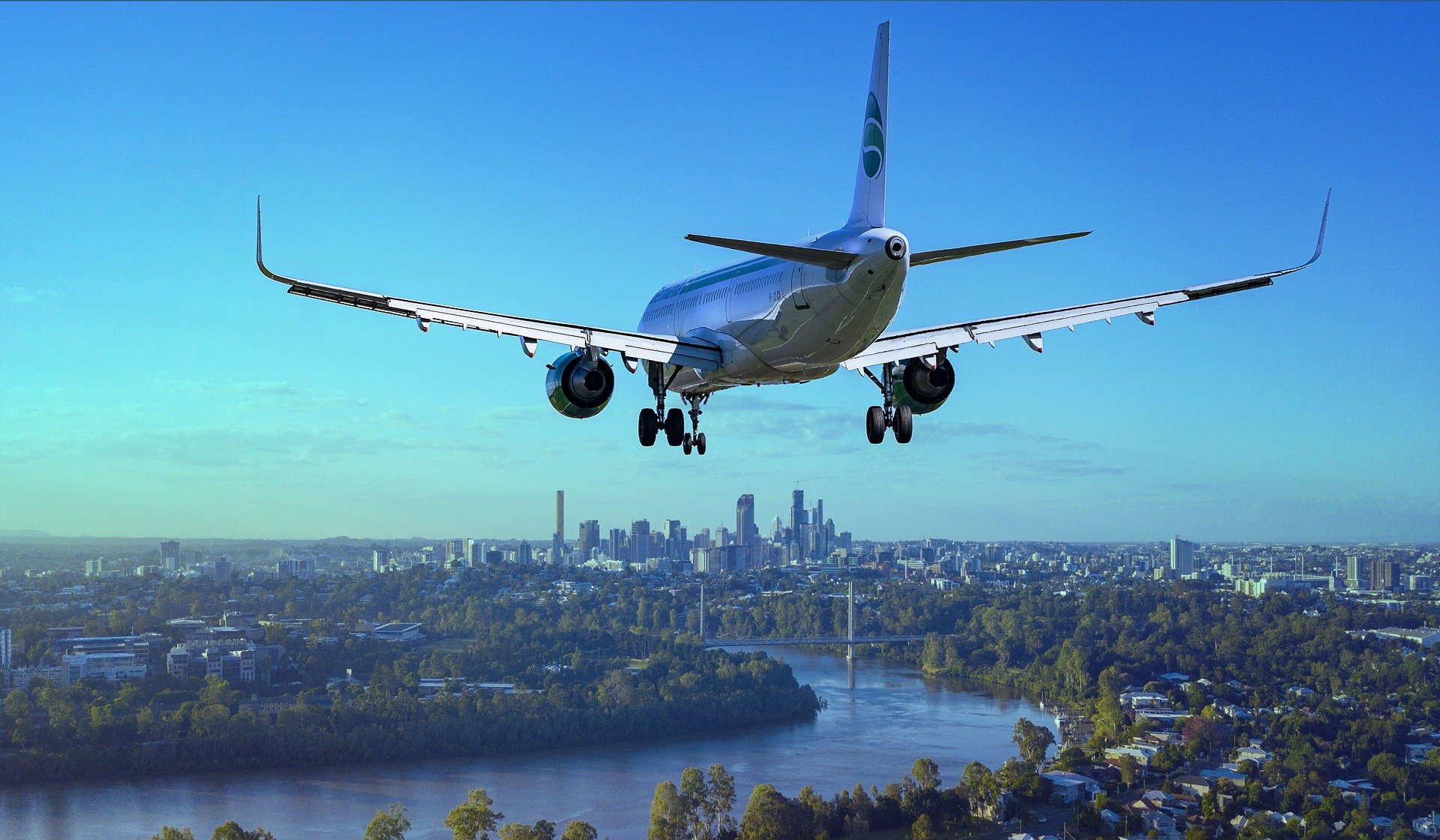 an airplane flying over a city