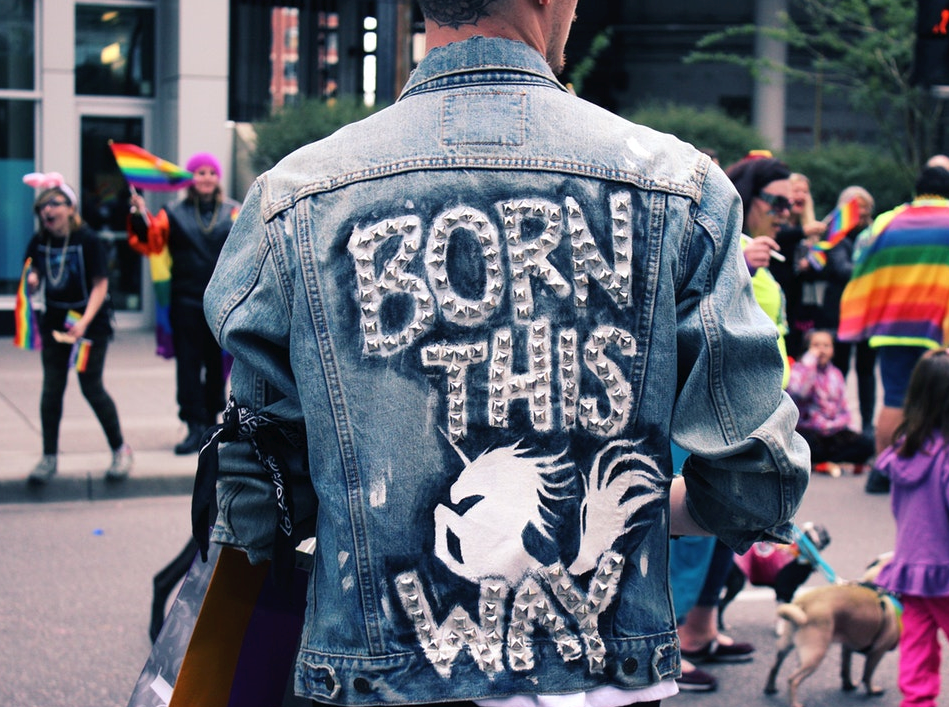 a person wearing a black jacket with a white and black graphic design on it