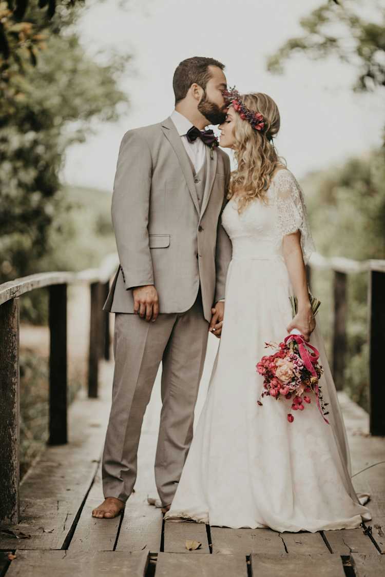 Photo of a man kissing a womans forehead