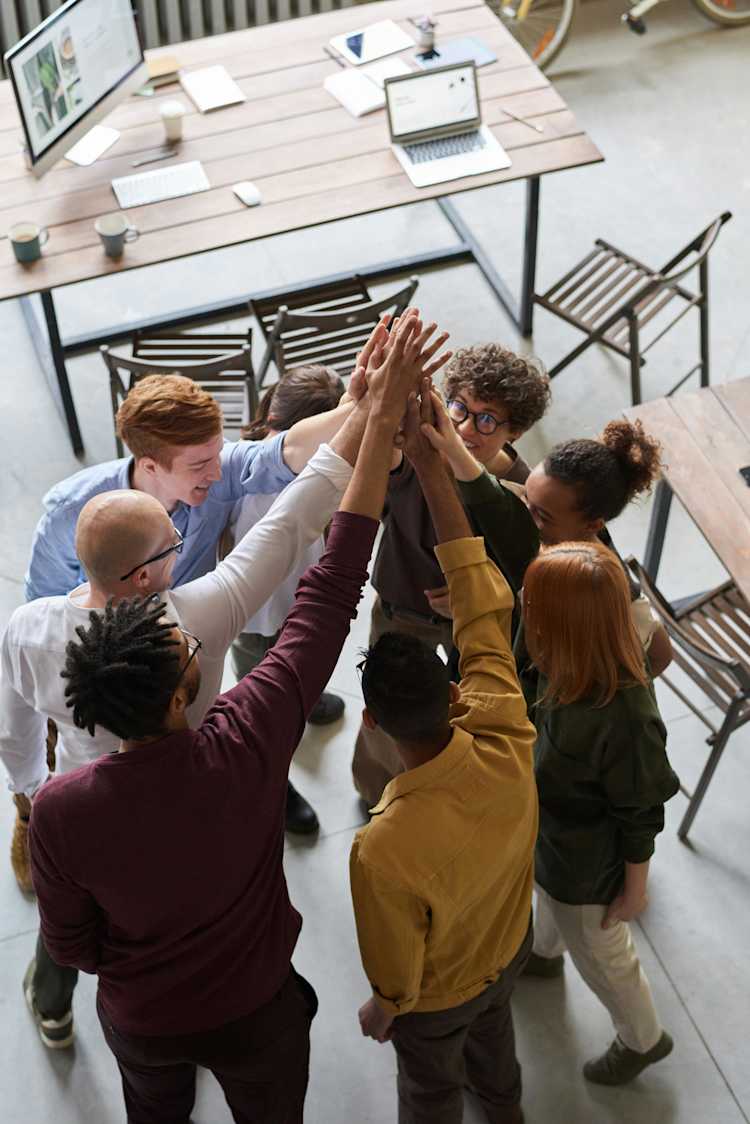 Photo of people holding each other's hands