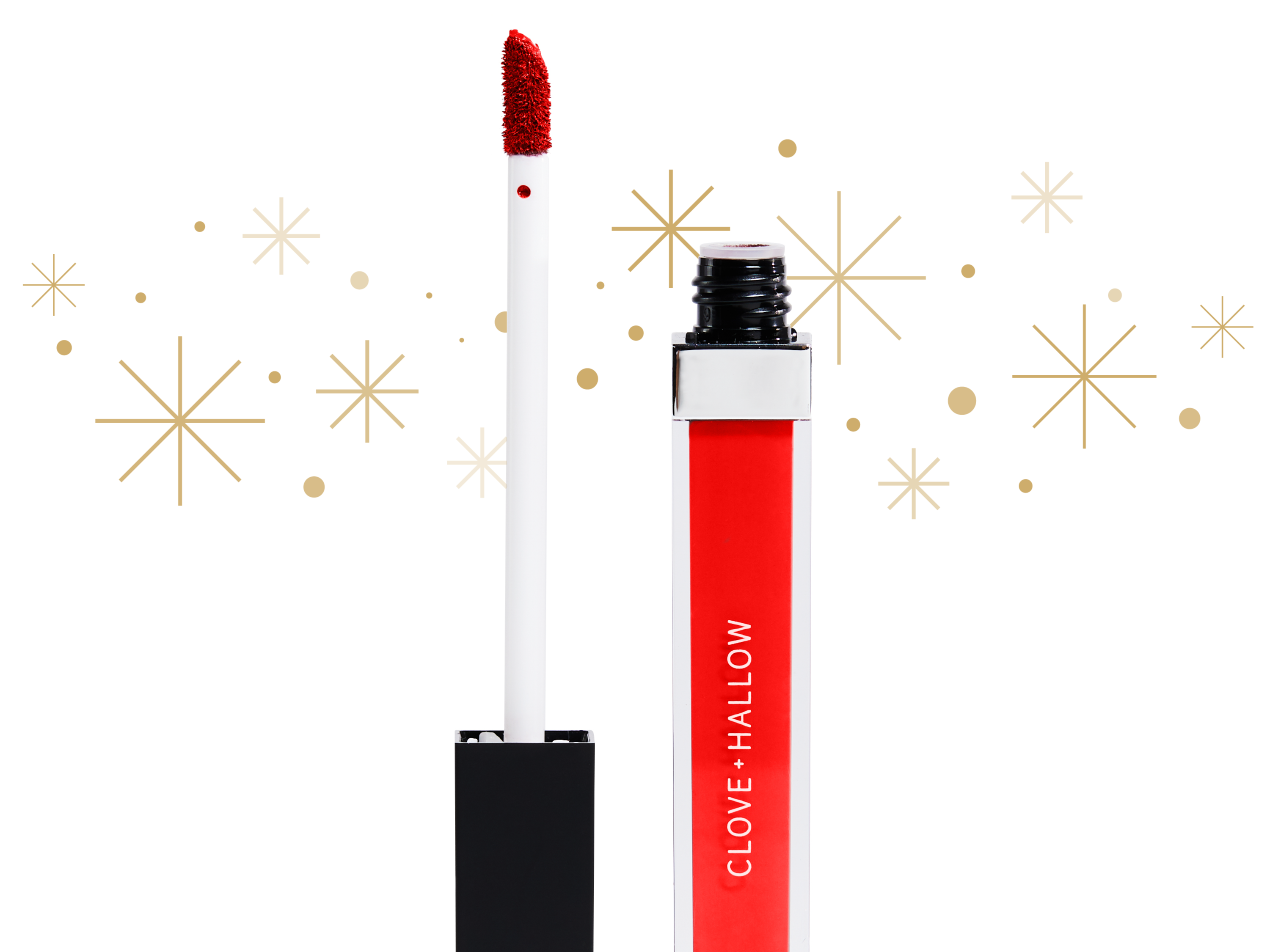Photo of red Clove + Hallow lip velvet lipstick with white background and gold sparkles