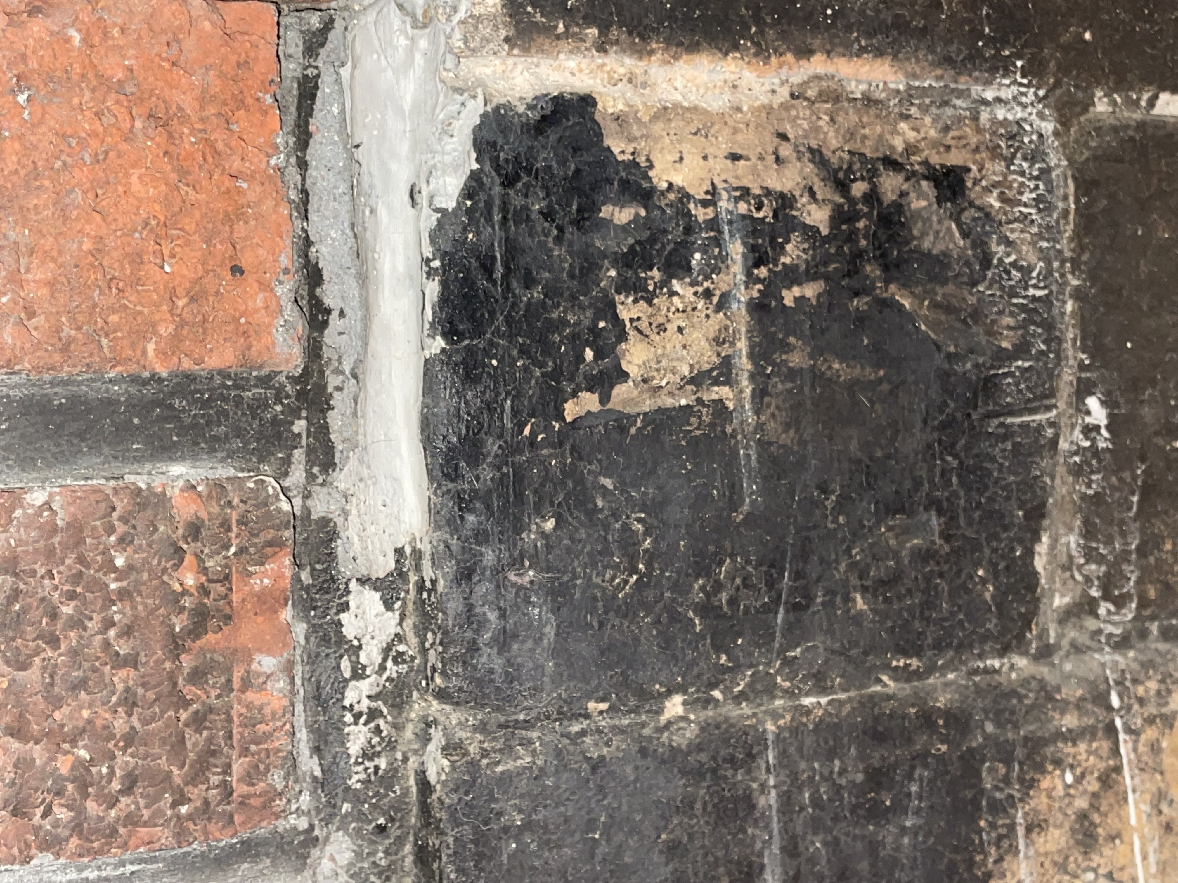 a closeup of the fireplace stone creosote after it's been cleaned