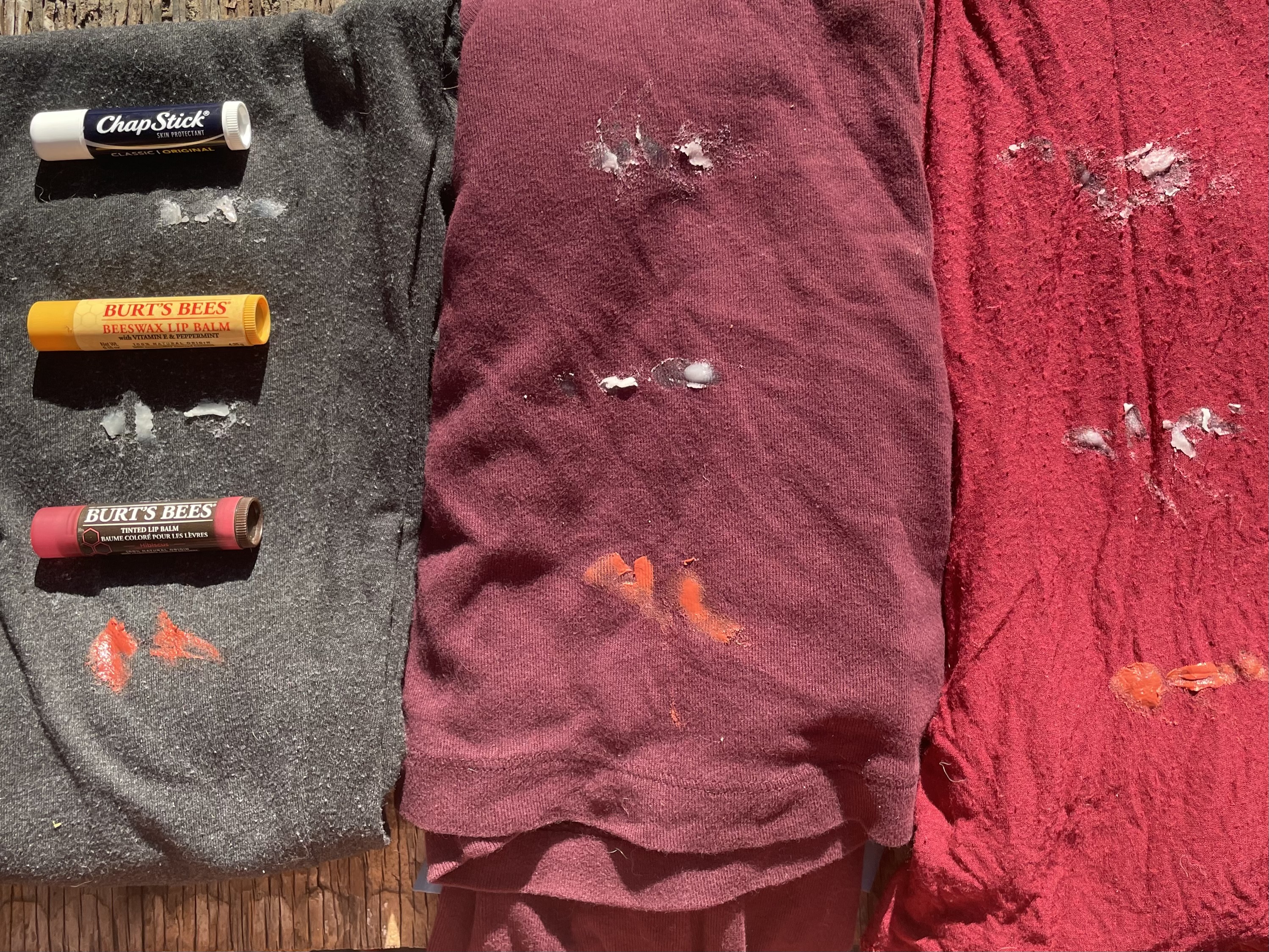 Three different shirts with chapstick stains