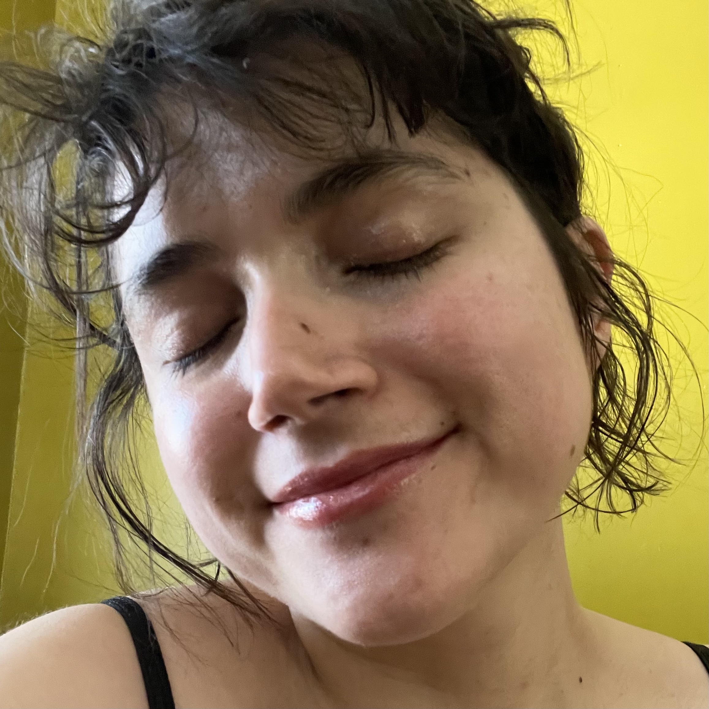 the author showing off her moisturized face after ice rolling