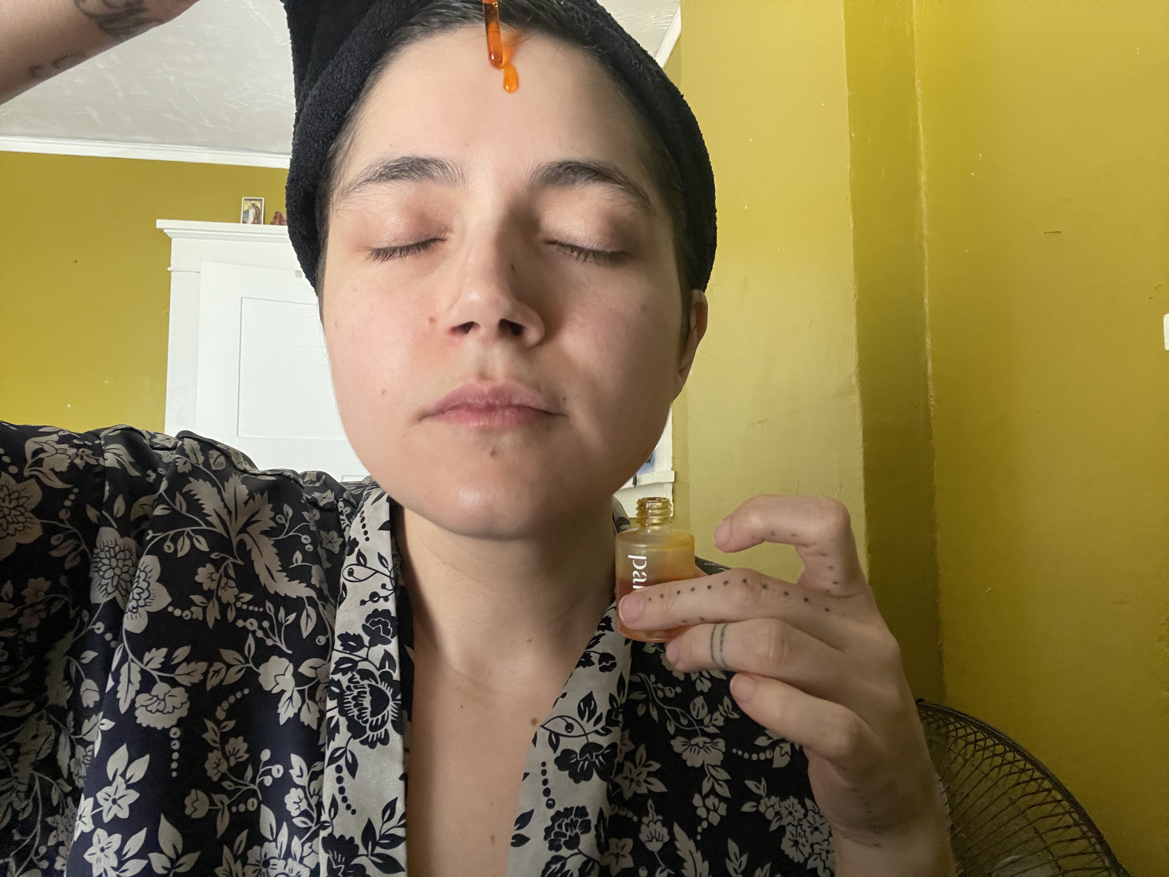 Image of writer applying Pai Rosehip Oil to face