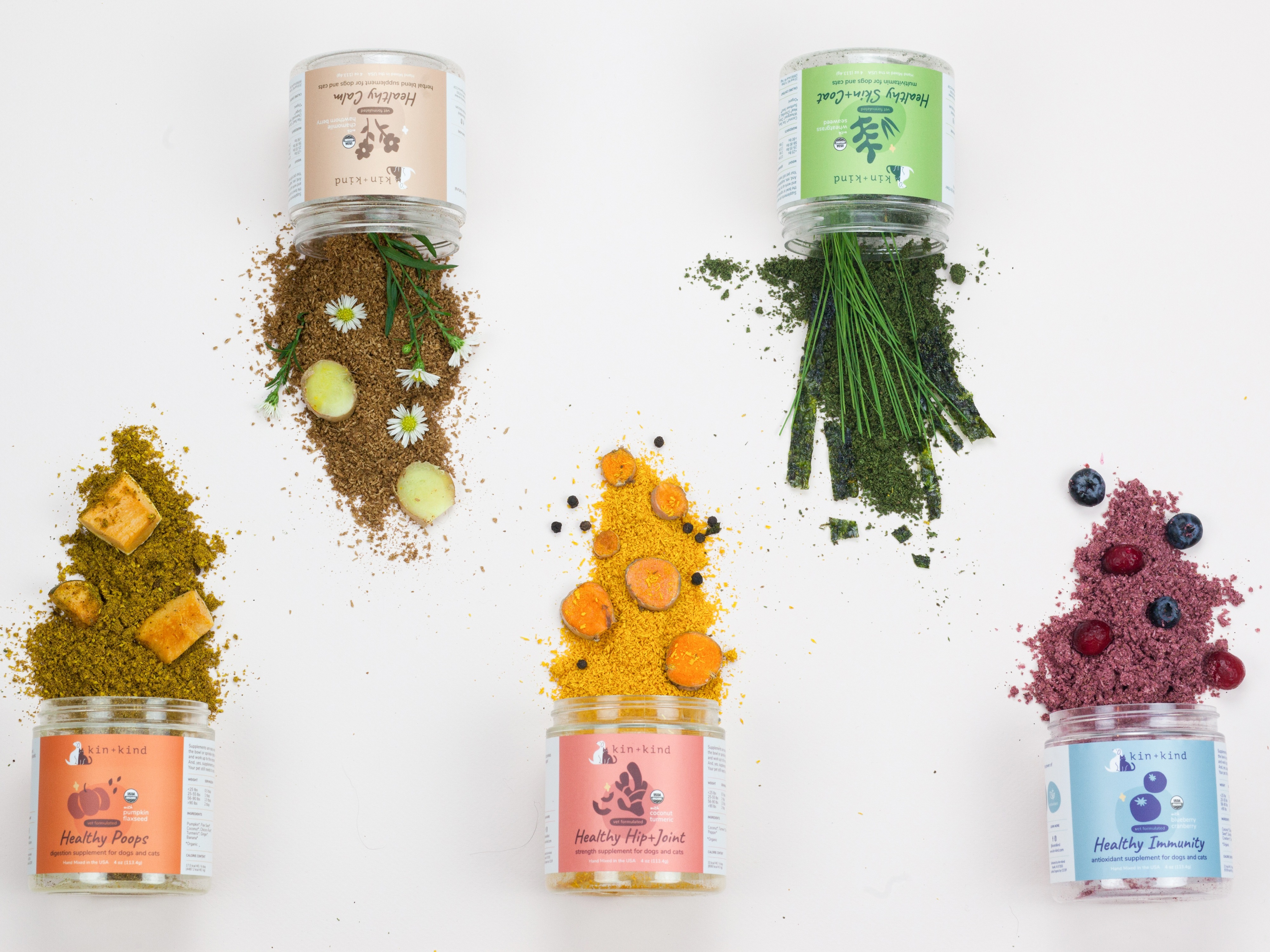 Image of 5 containers of pet supplements with ingredients and powder spilling out