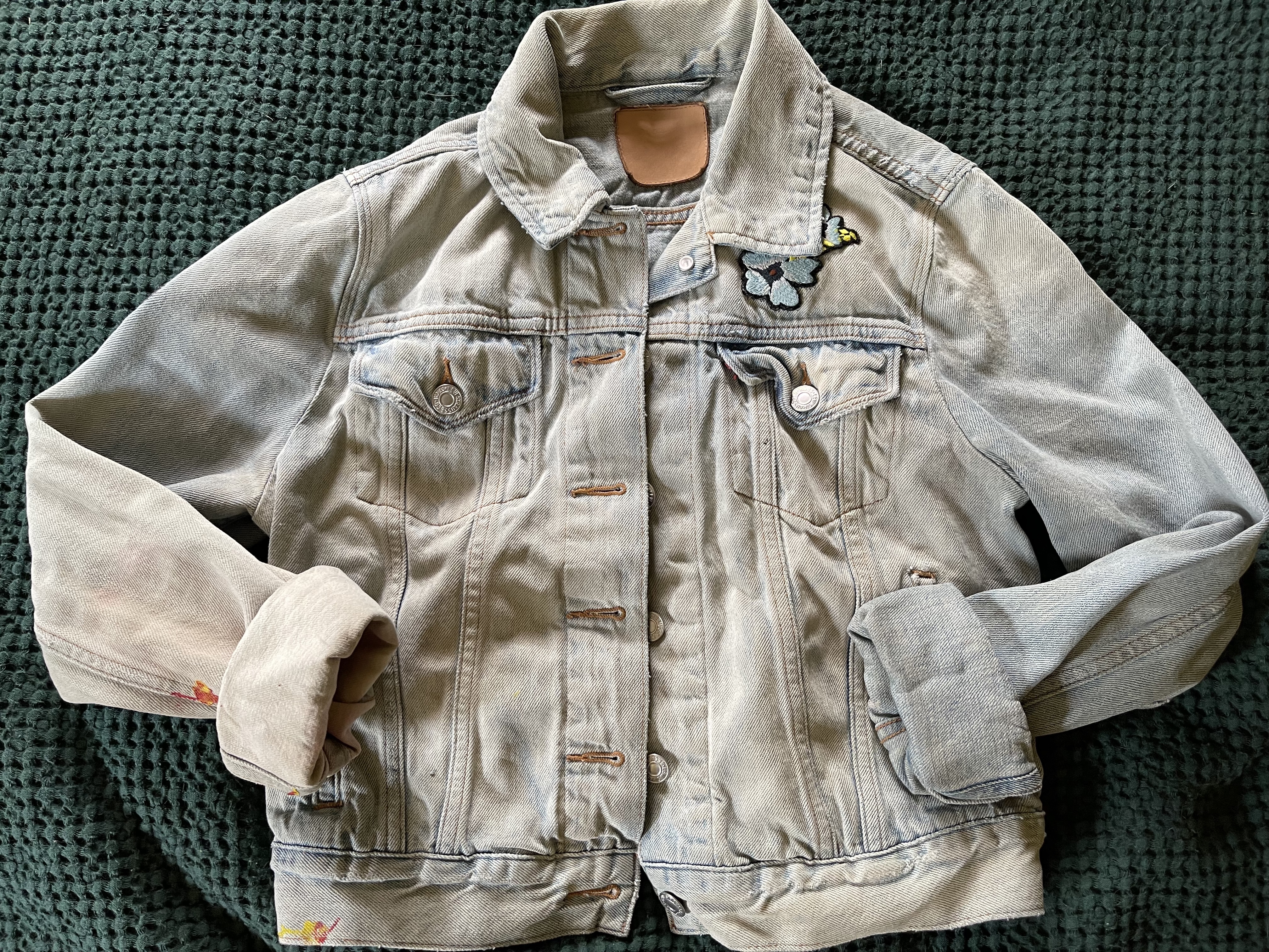 a jean jacket after it's been laundry stripped.