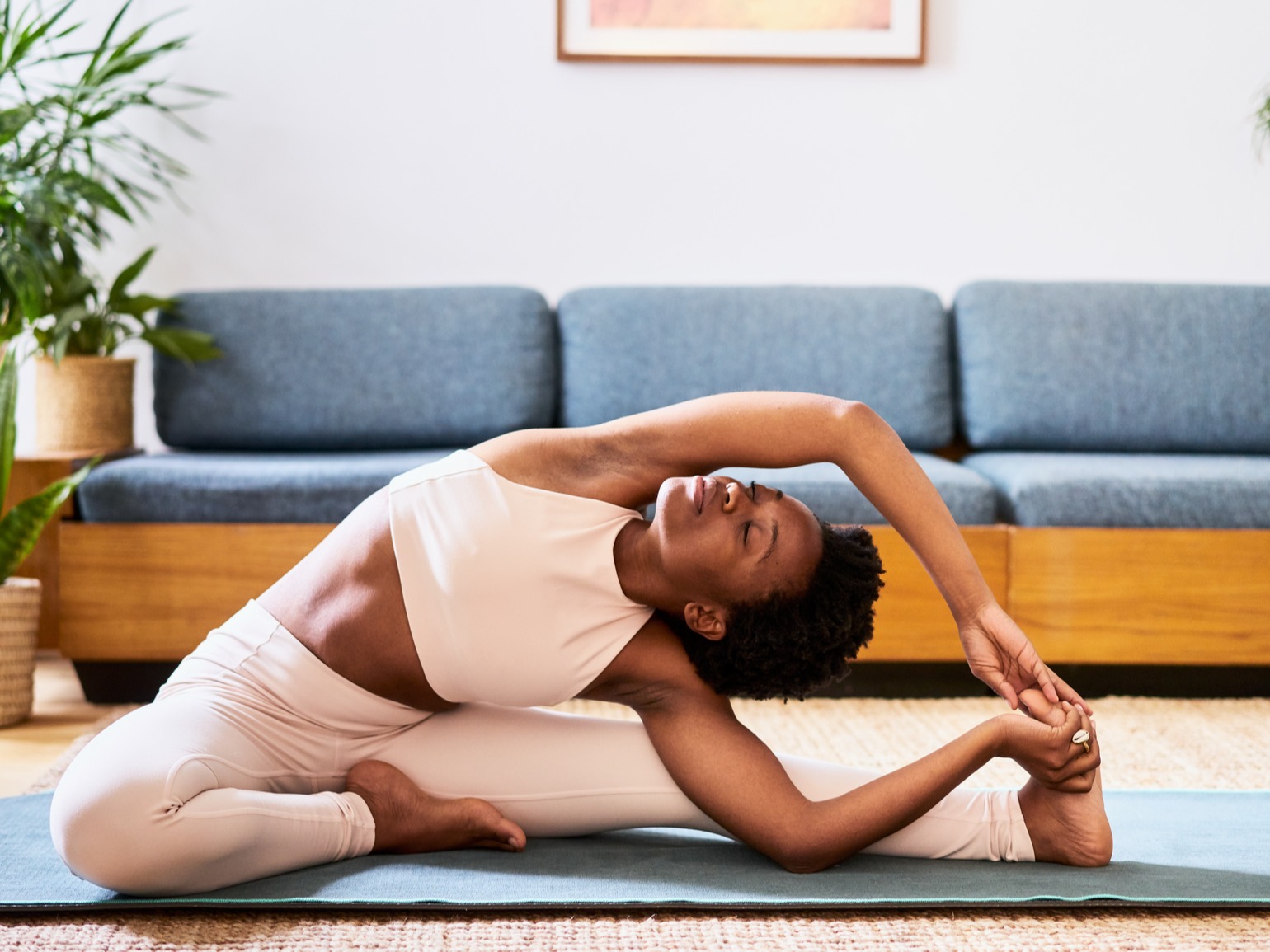 Woman doing yoga on yoga mat