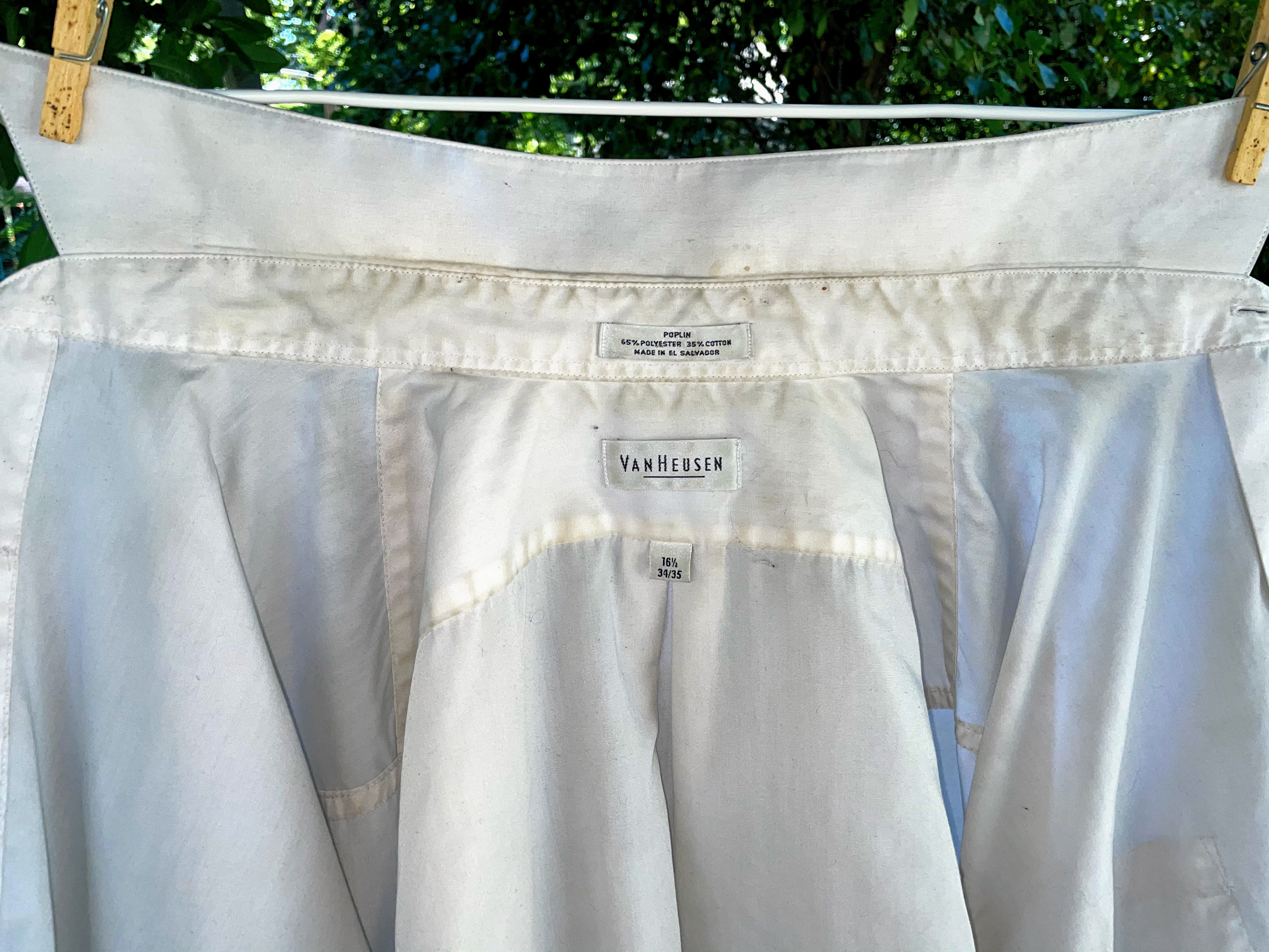 Photo of dirty white shirt hanging on clothesline