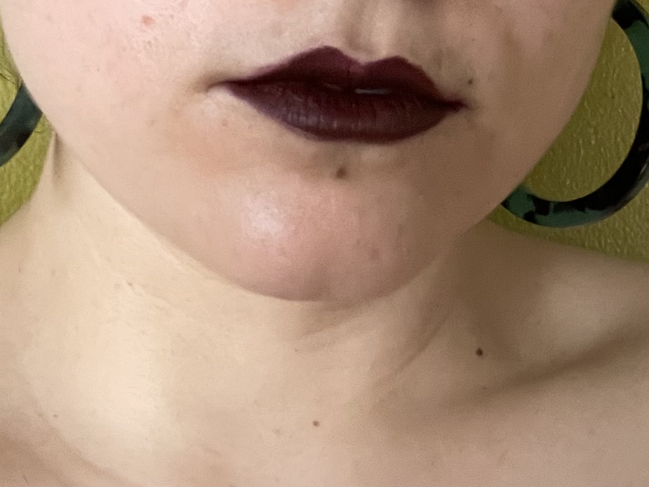 the author in a deep plum lip color with smooth, hydrated lips