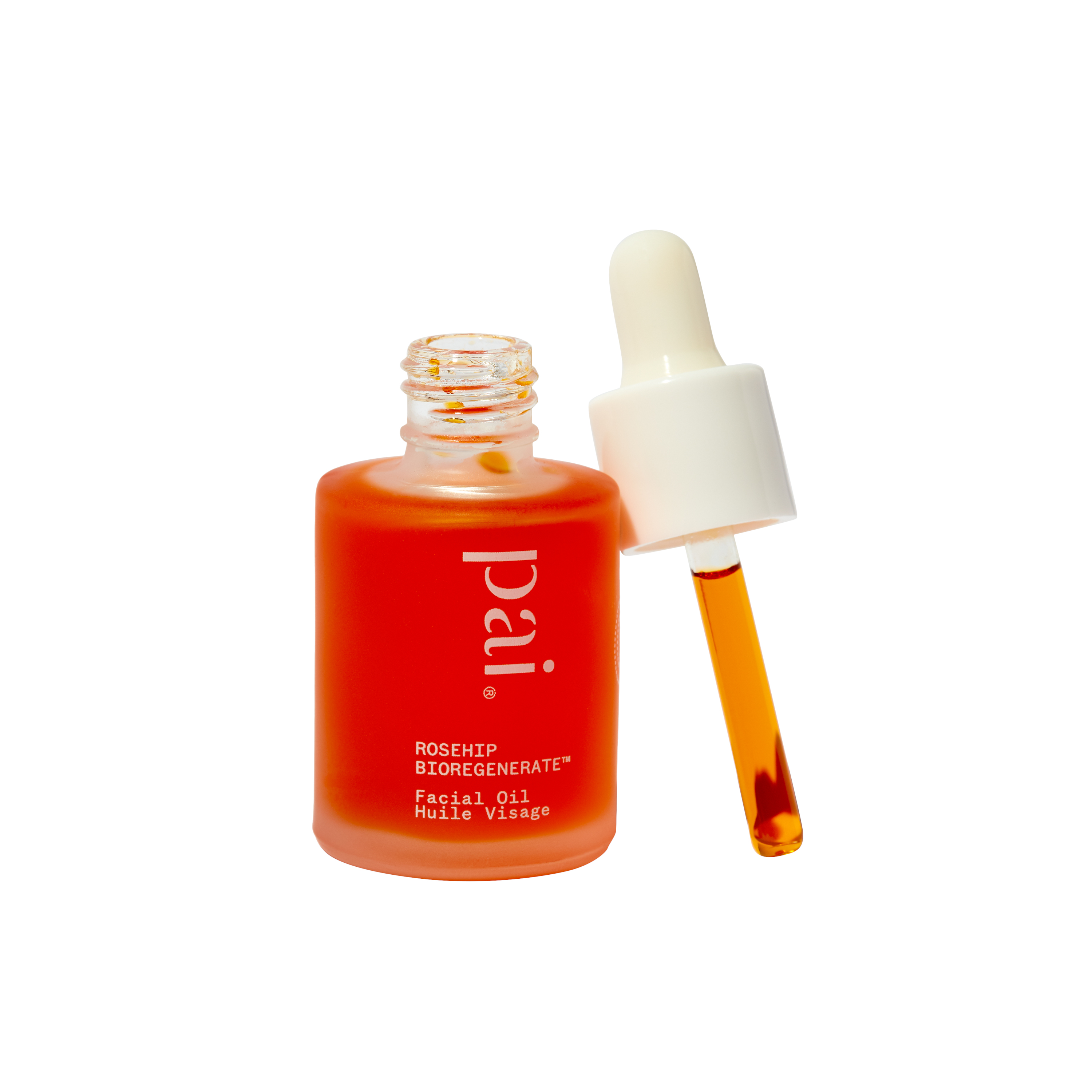 Pai Rosehip Oil bottle with dropper leaning up against it