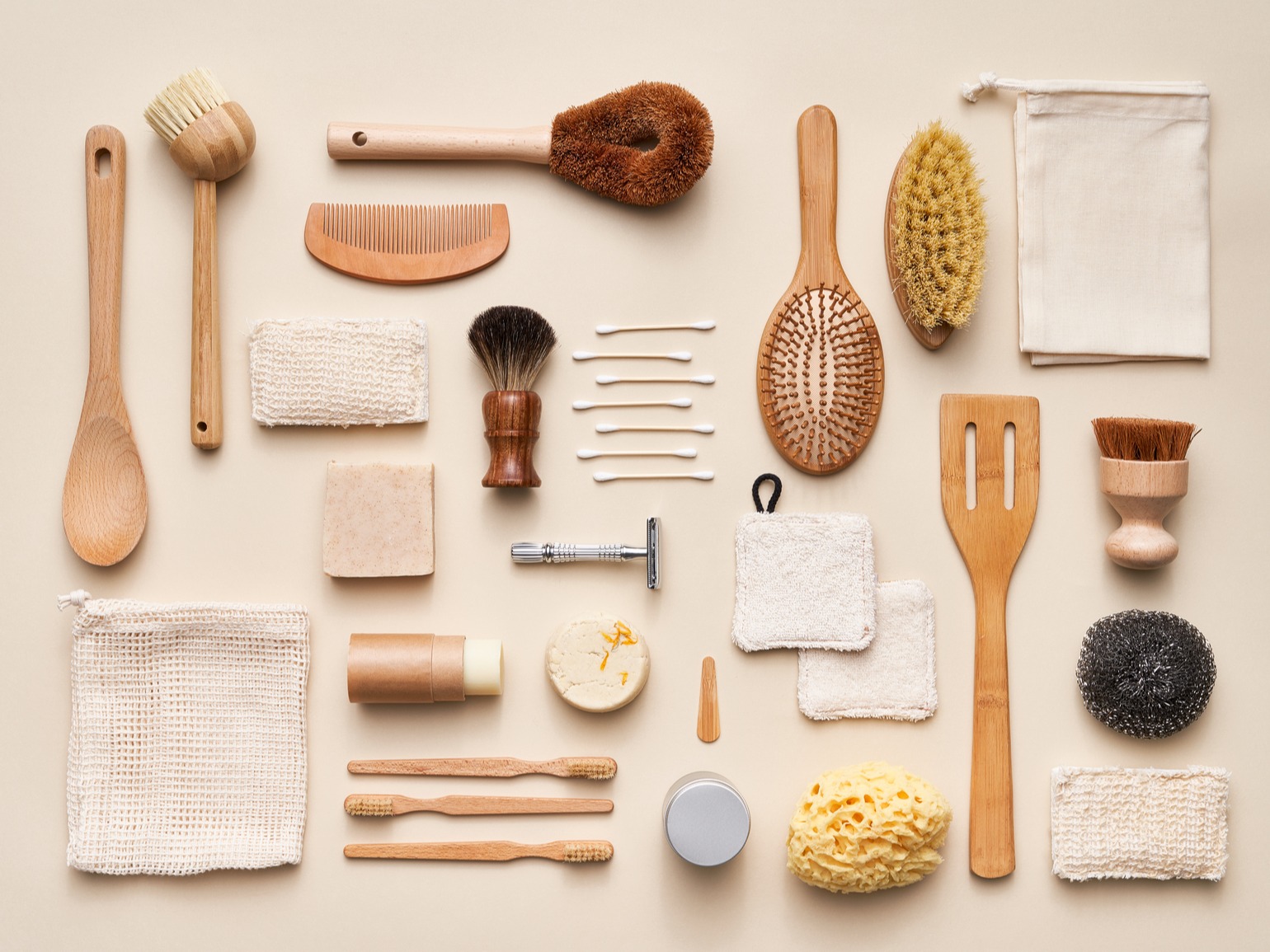flat lay of bamboo items and multiple bristle brushes for dry brushing