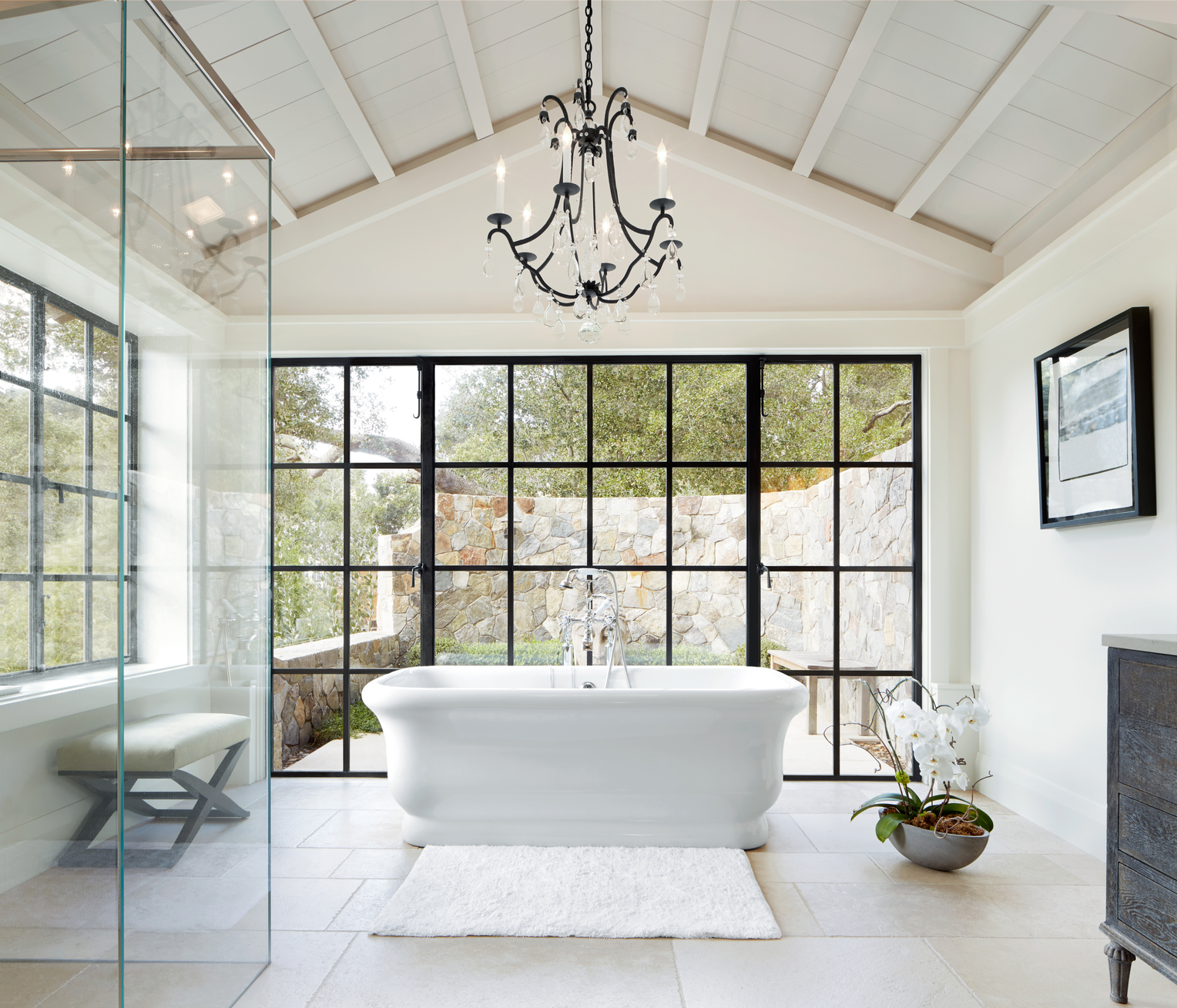Image of a bathroom with a chandelier. 