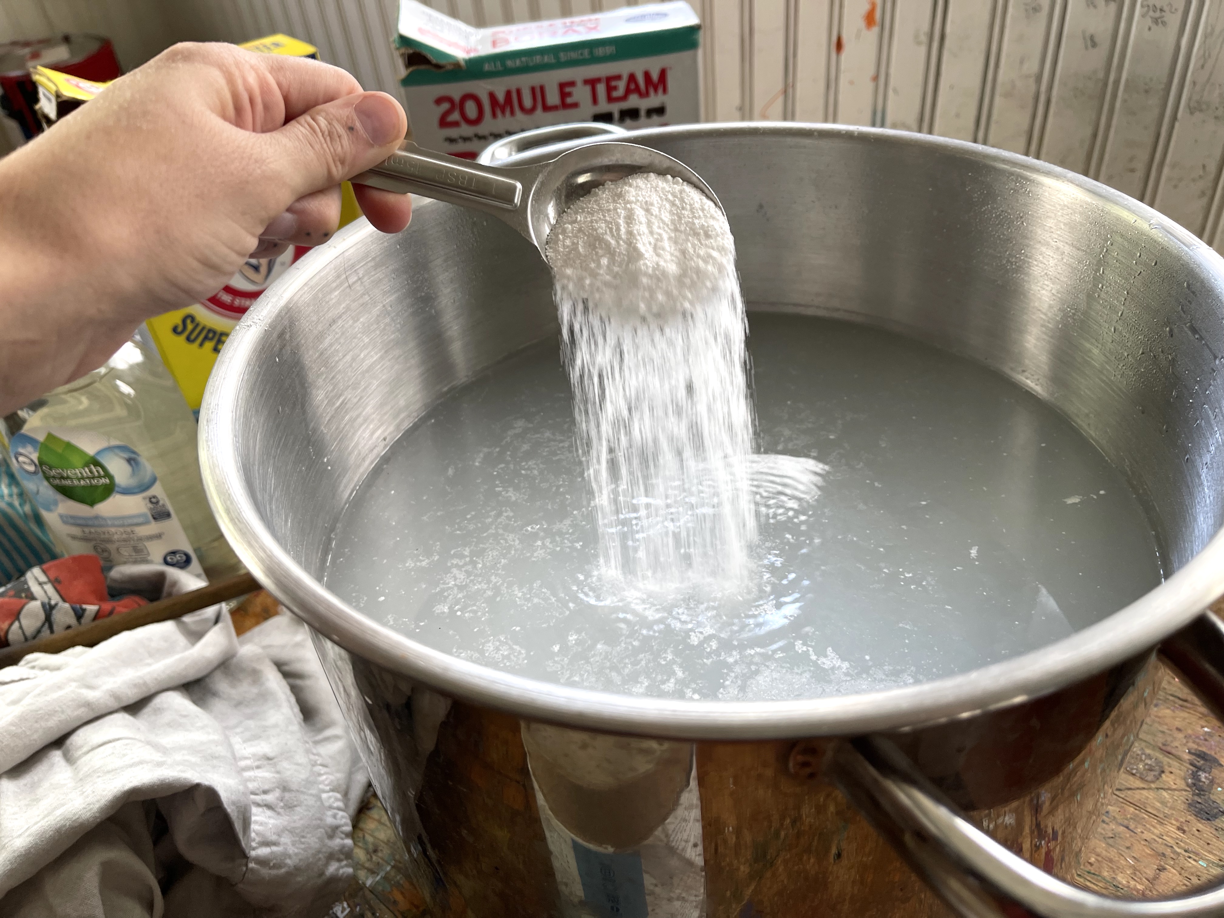 a large pot filled with water being prepared for laundry stripping.