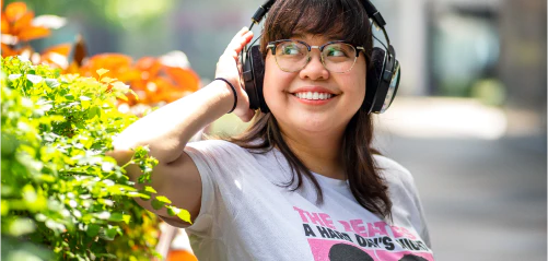 Woman listening to music on headphones