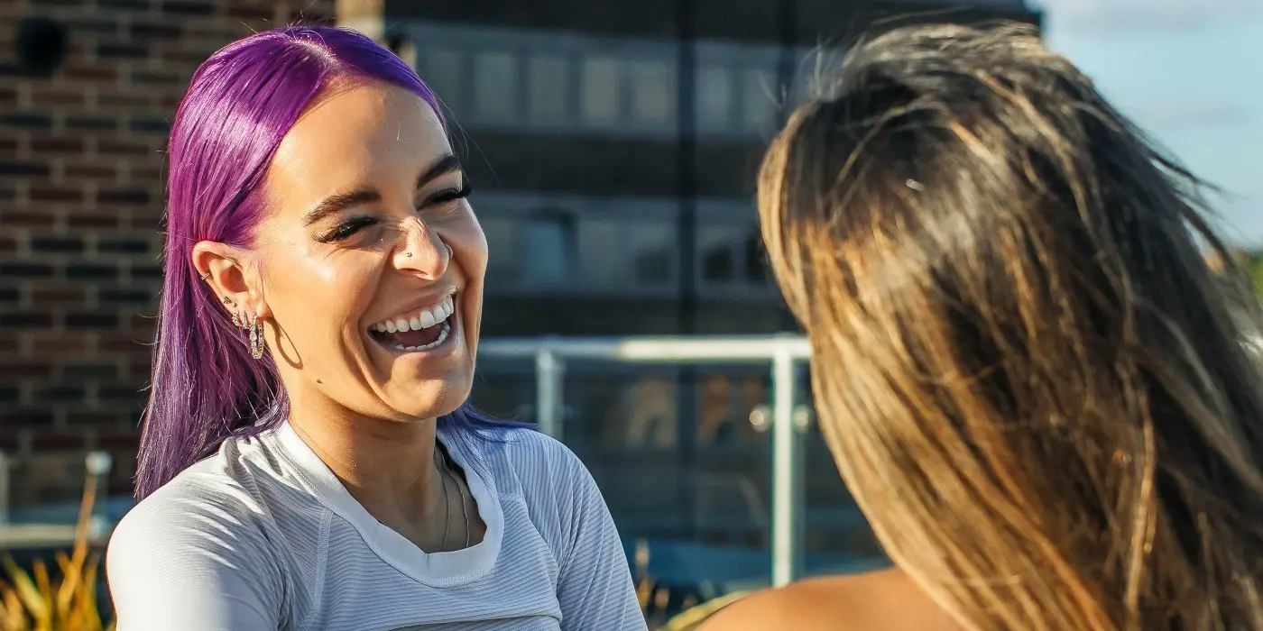 Woman laughing outdoors